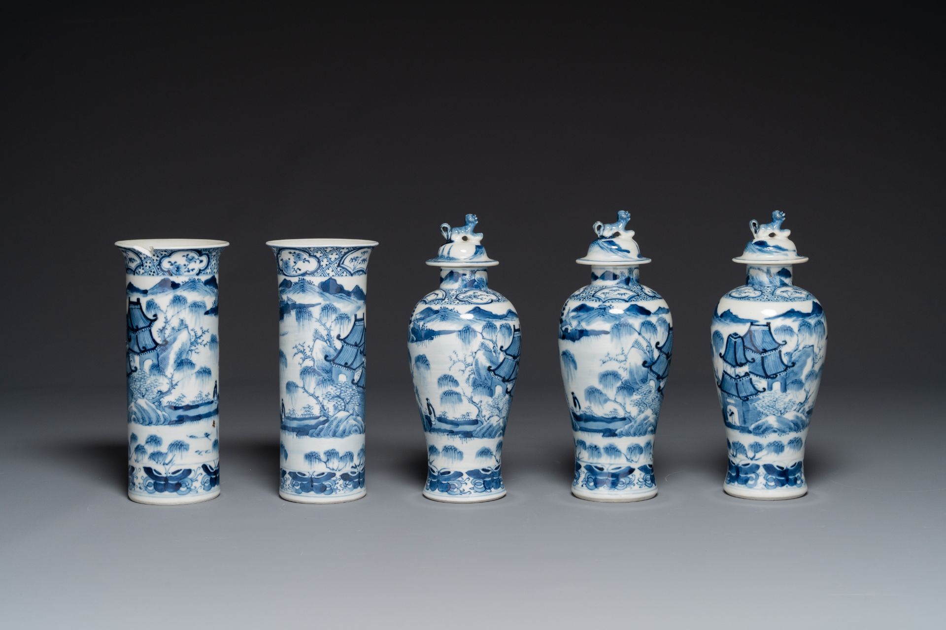 A Chinese blue and white garniture of five vases with landscape design, 19th C. - Image 2 of 6