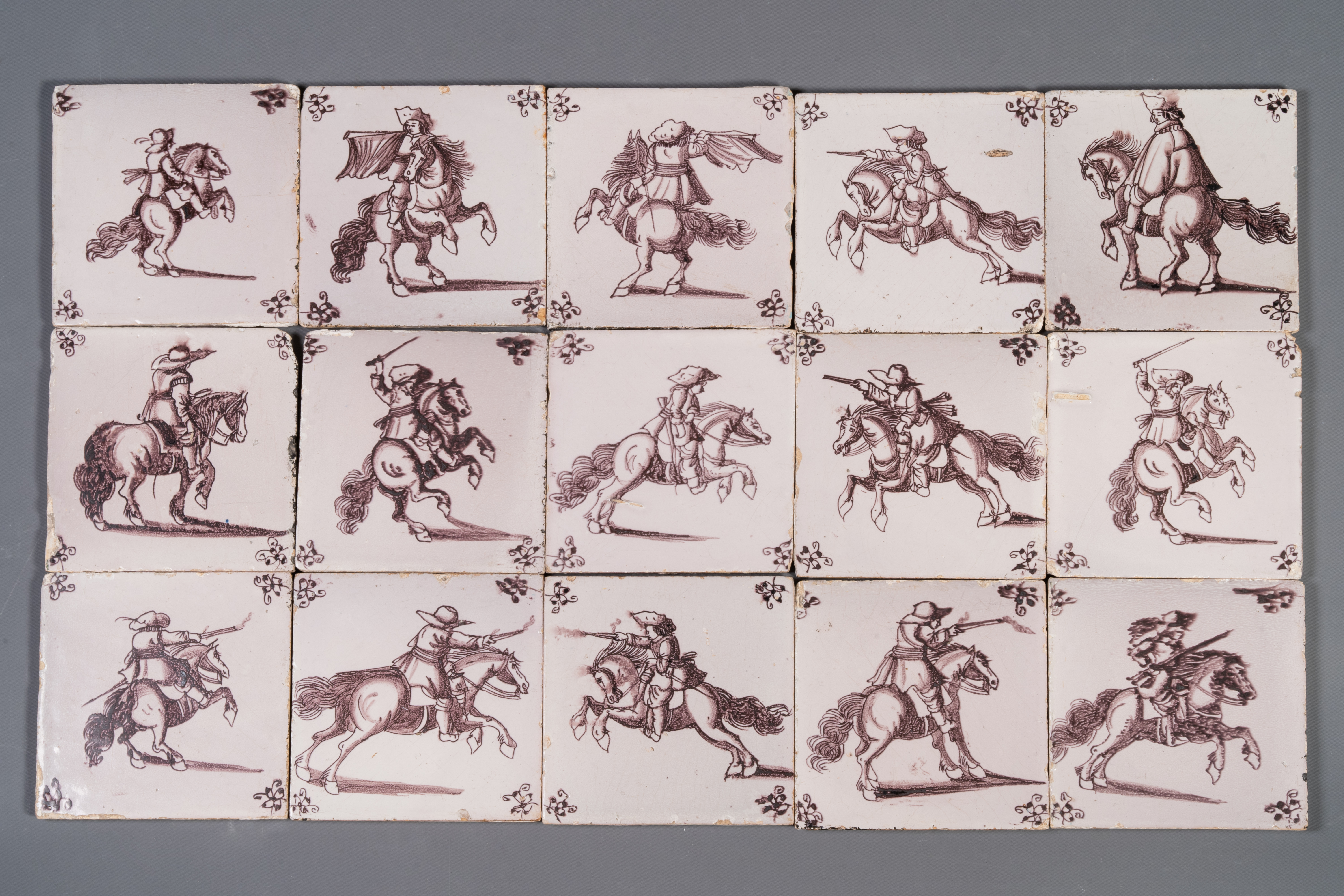 Fifteen Dutch Delft manganese tiles with horse riders, late 17th C.