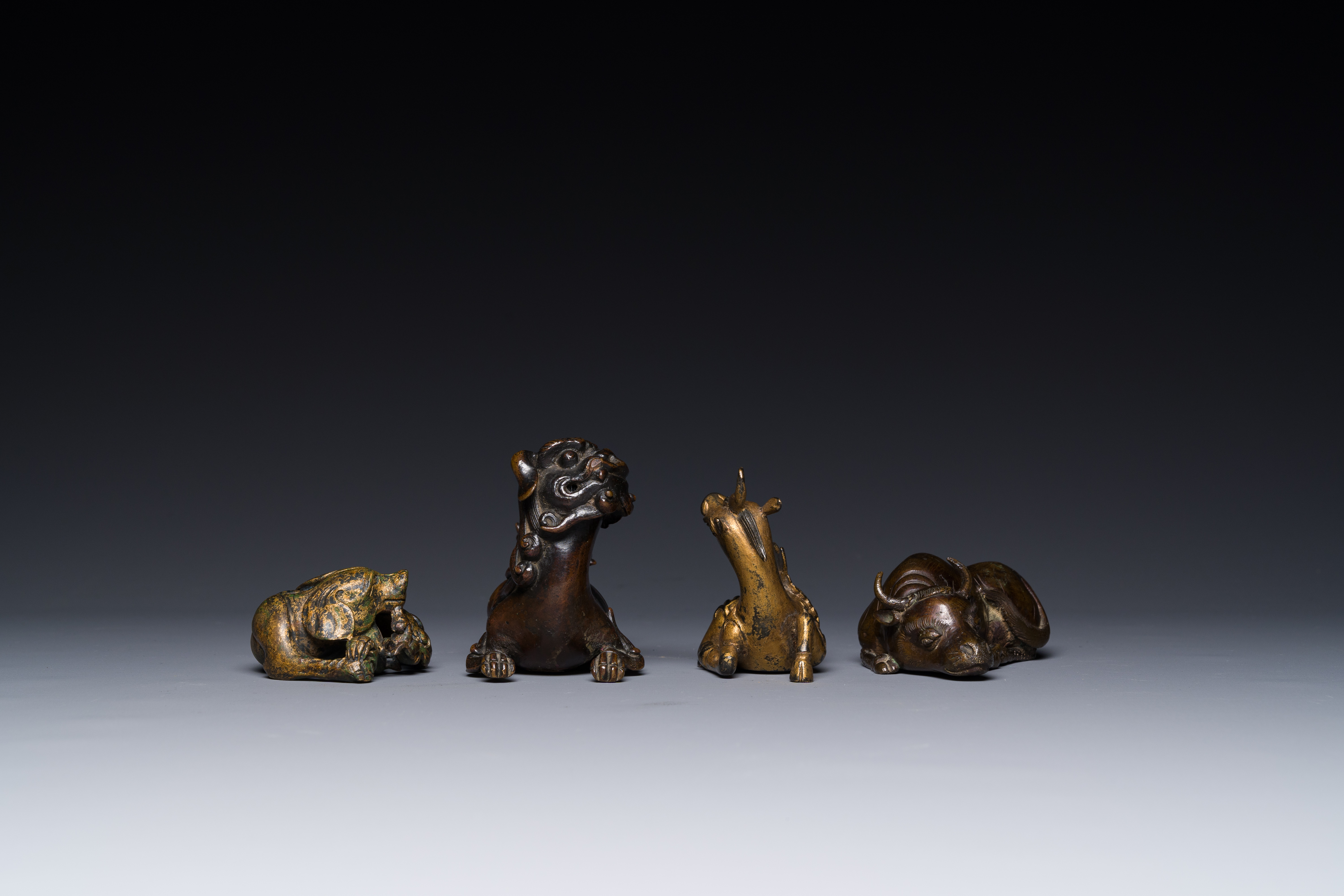 A group of four Chinese gilt bronze paper-weights, Ming/Qing - Image 4 of 7