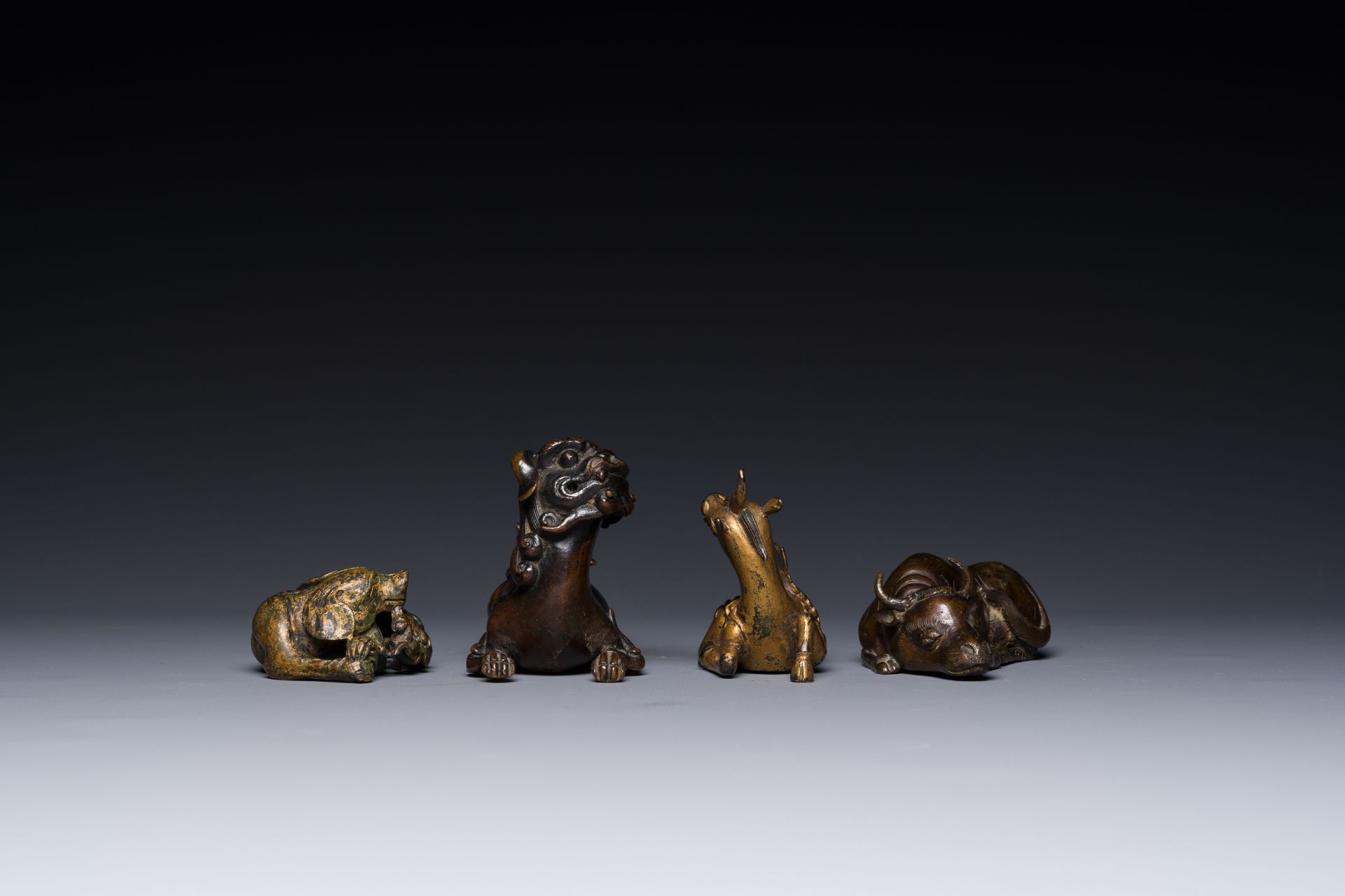 A group of four Chinese gilt bronze paper-weights, Ming/Qing - Image 4 of 7