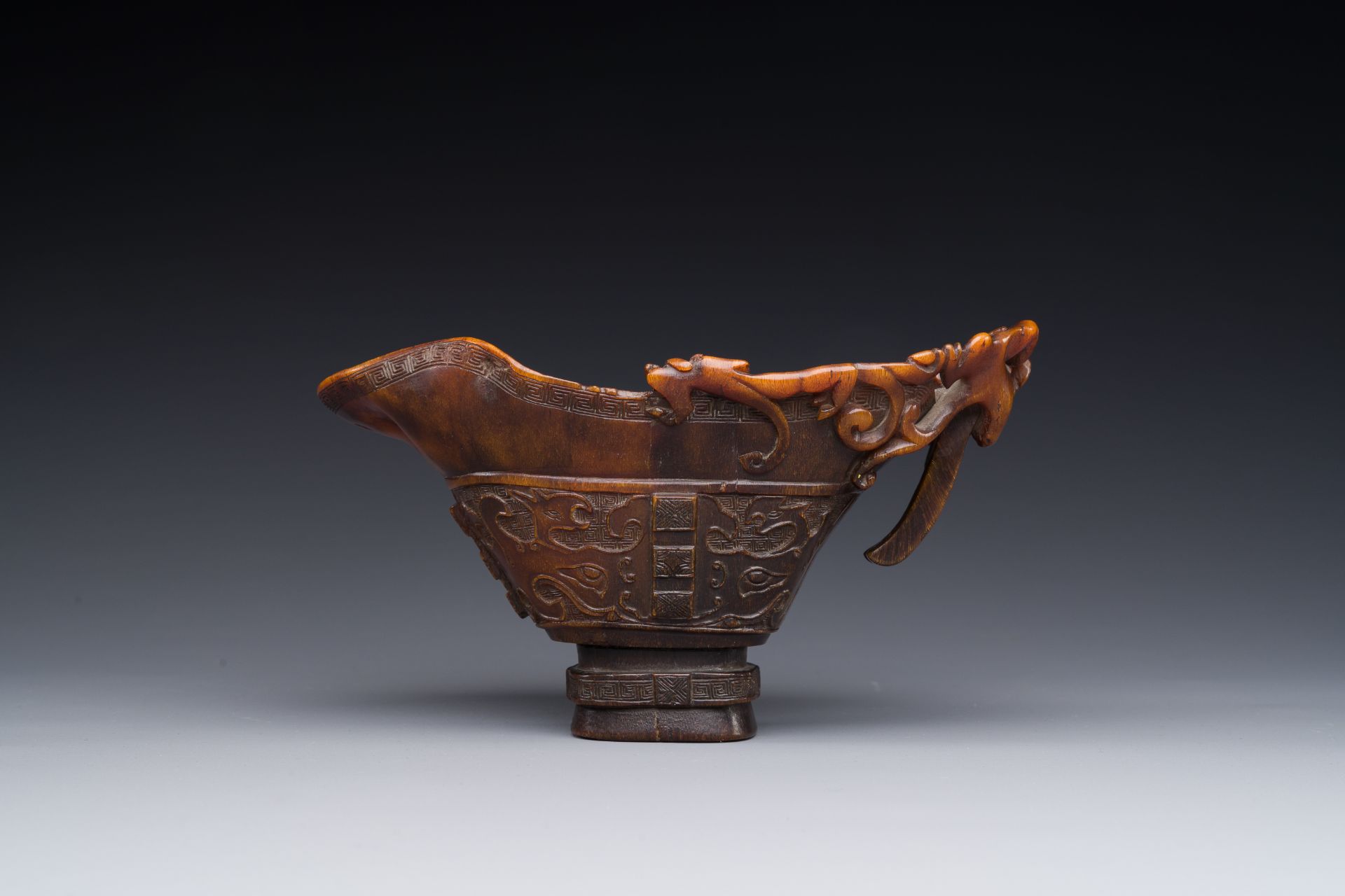 A Chinese carved rhinoceros horn 'libation cup' with chilong design, 17/18th C. - Image 3 of 8
