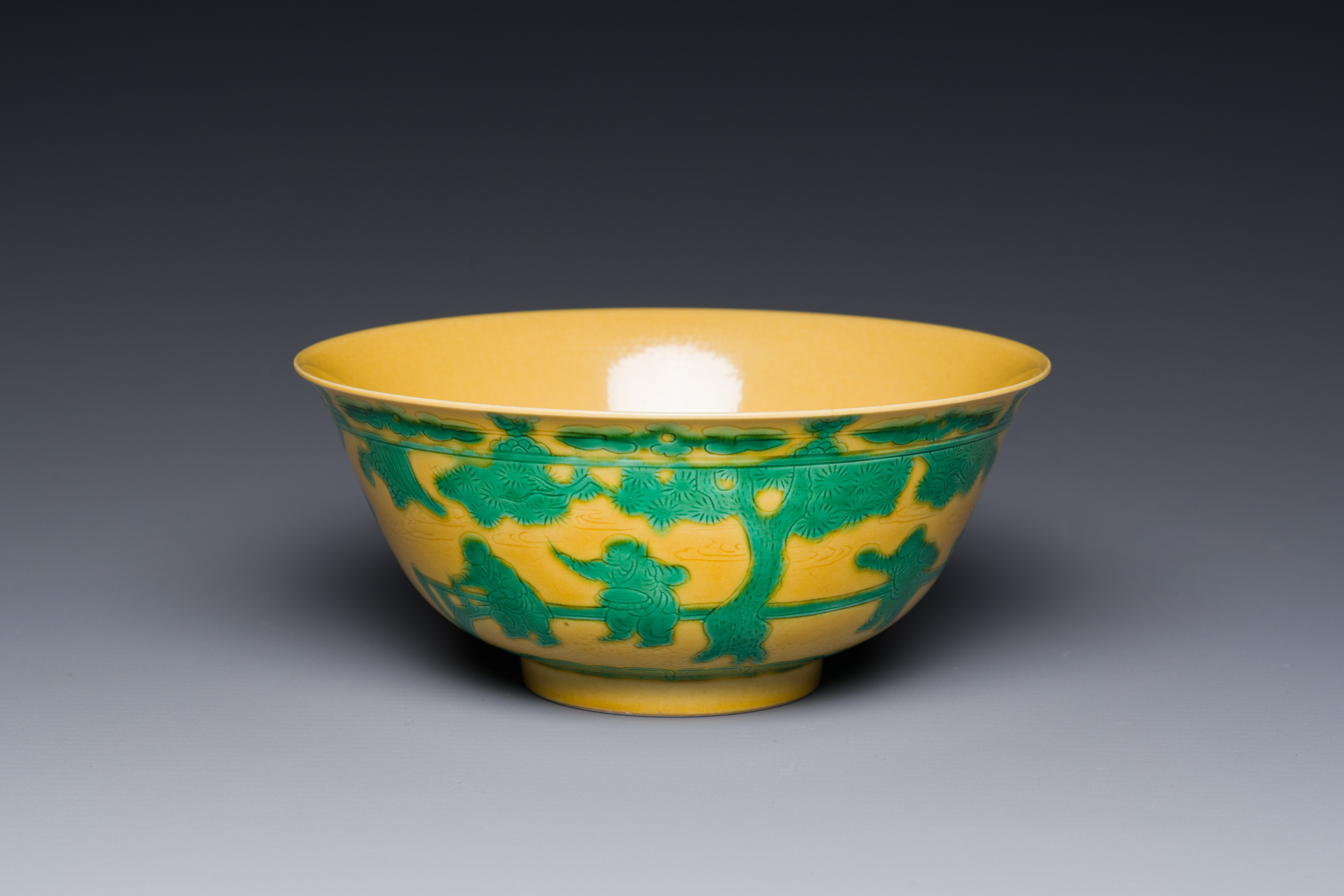 A Chinese yellow-ground 'playing boys' bowl, Yongzheng mark and prossibly of the period