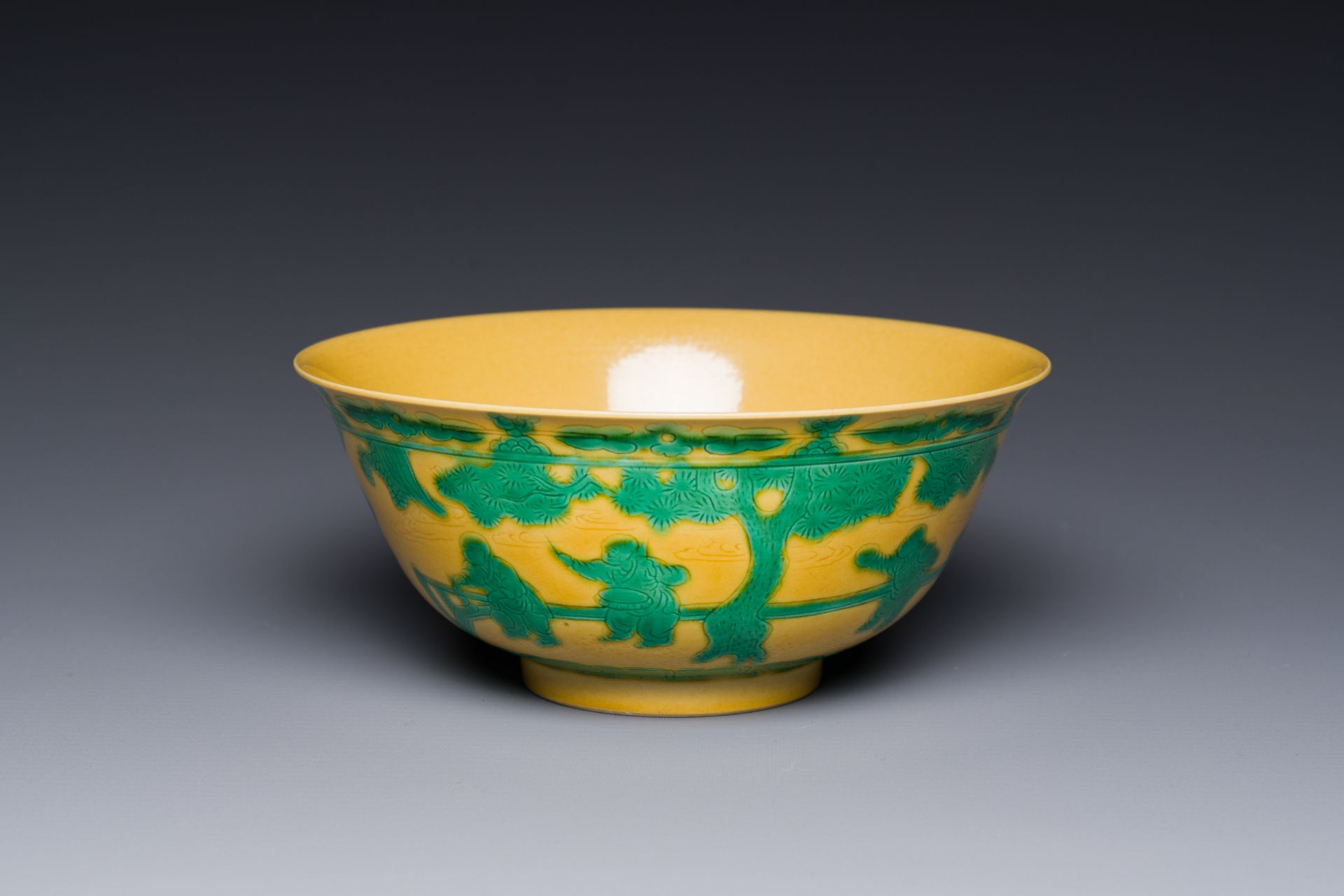 A Chinese yellow-ground 'playing boys' bowl, Yongzheng mark and prossibly of the period