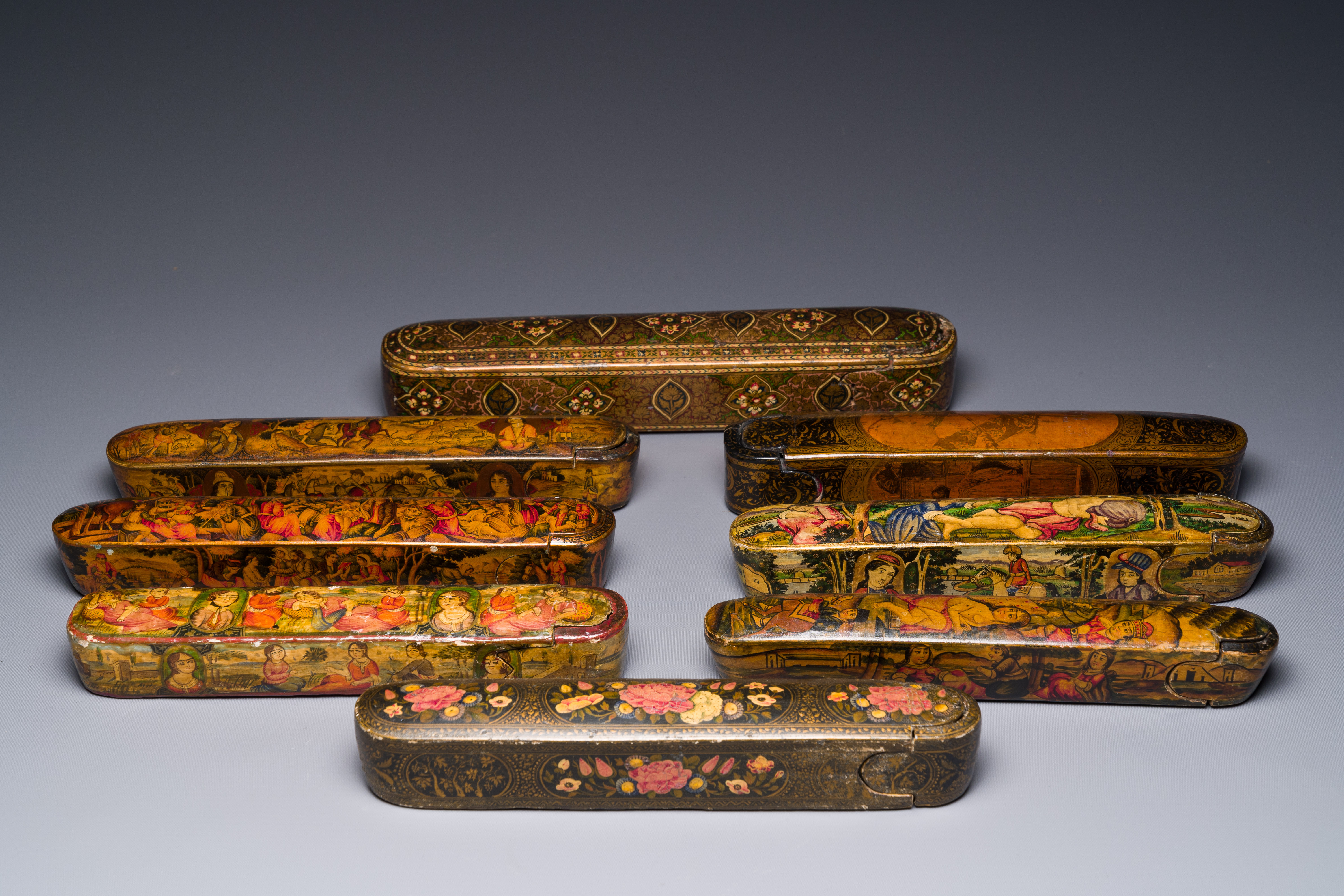 A collection of eight lacquered papier-mache pen boxes or qalamdans, Qajar, Persia, 19th C.