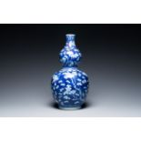 A Chinese blue and white double gourd 'prunus on cracked ice' vase, 18th C.