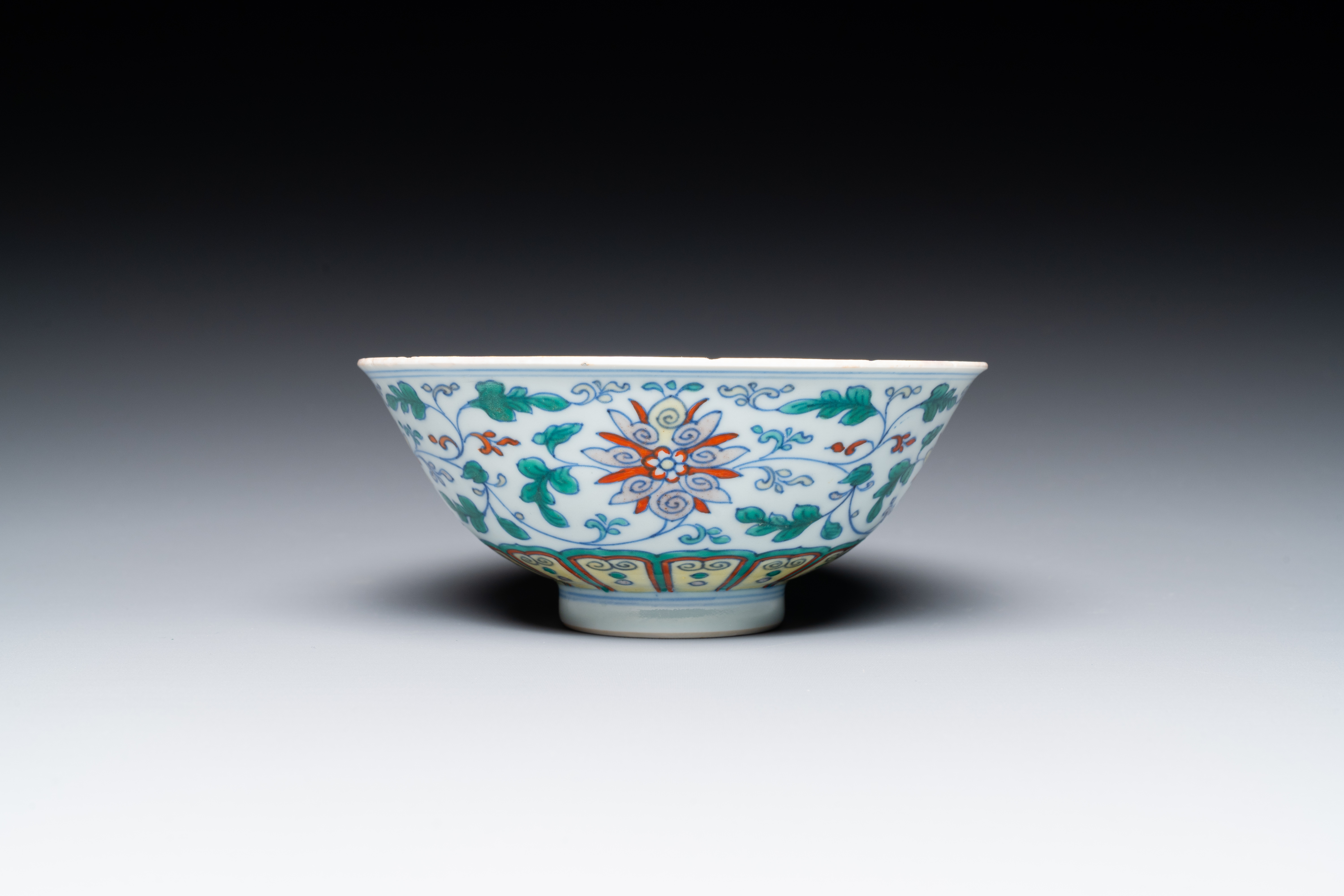 A Chinese doucai 'lotus scroll' bowl, Qianlong mark and of the period - Image 5 of 7