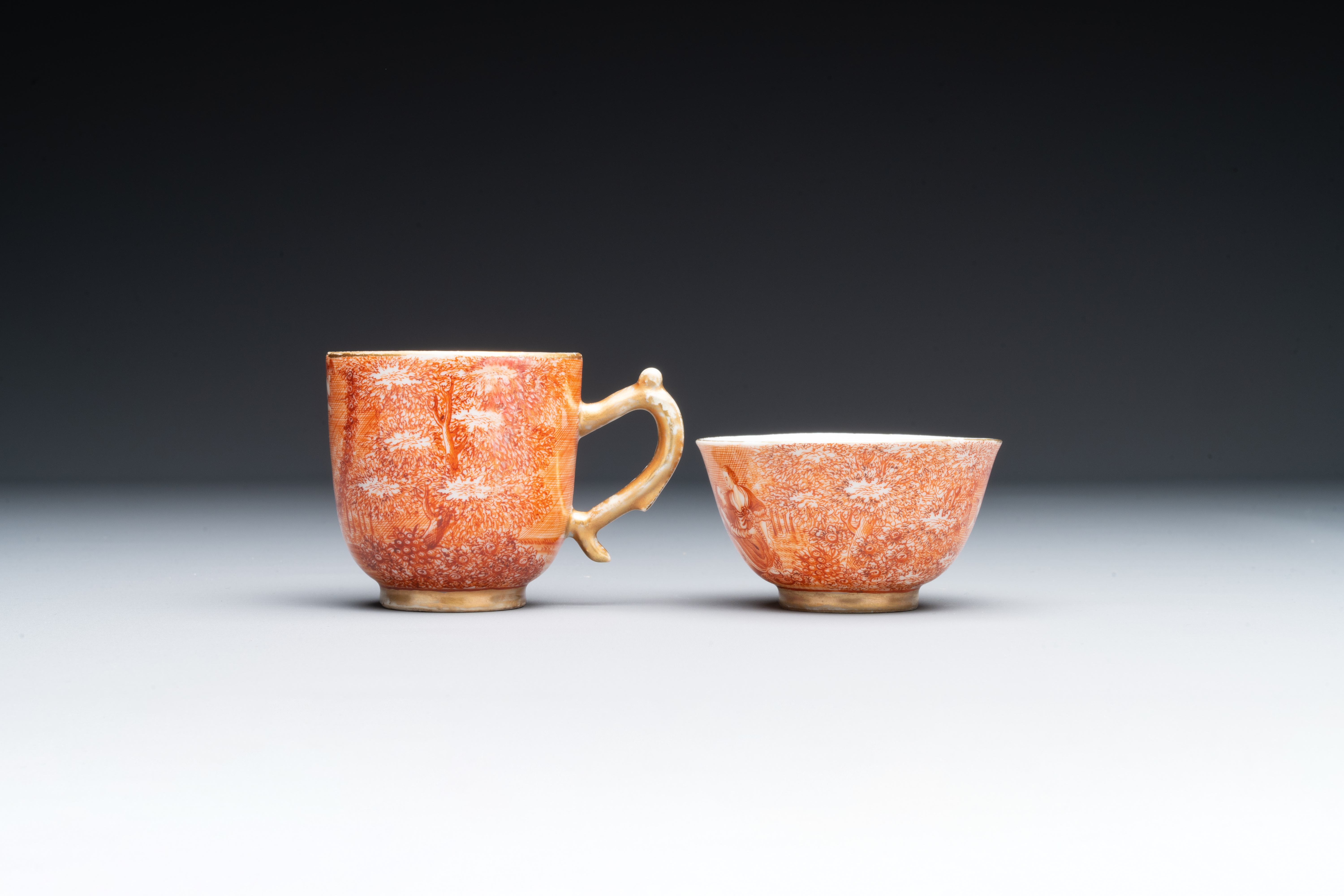 Two rare Chinese iron-red-decorated 'European scene' cups and a saucer, Qianlong - Image 6 of 8
