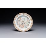 A rare Chinese Canton famille rose plate depicting an official traveling along the Pearl River towar
