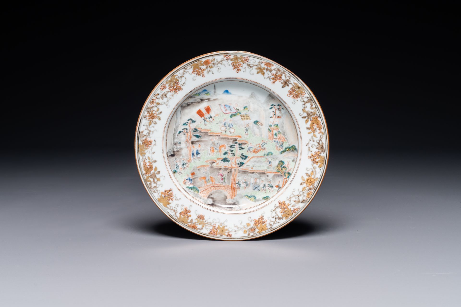A rare Chinese Canton famille rose plate depicting an official traveling along the Pearl River towar