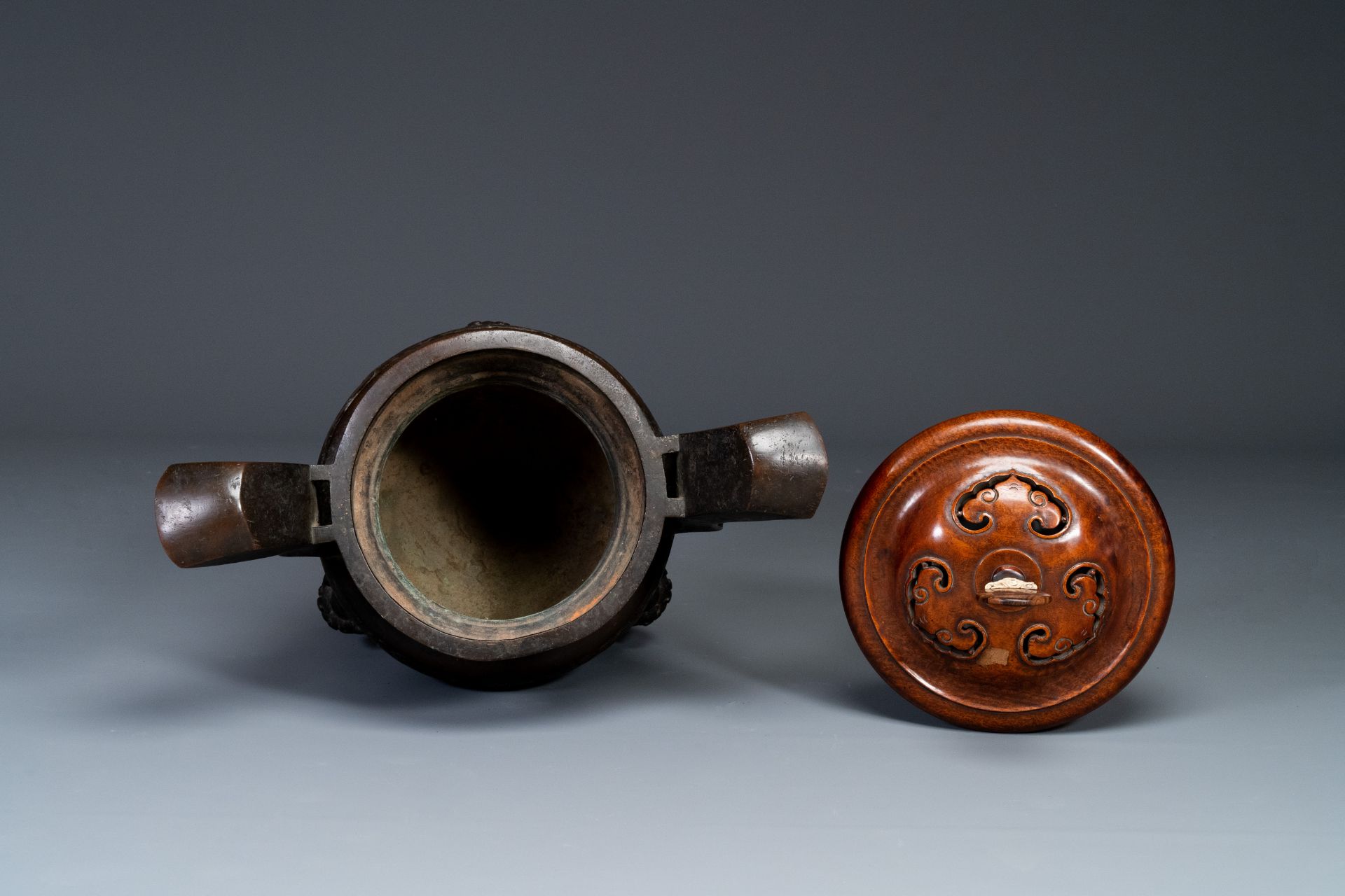 An important Chinese bronze tripod 'taotie' censer with wooden lid, Ming - Image 14 of 18