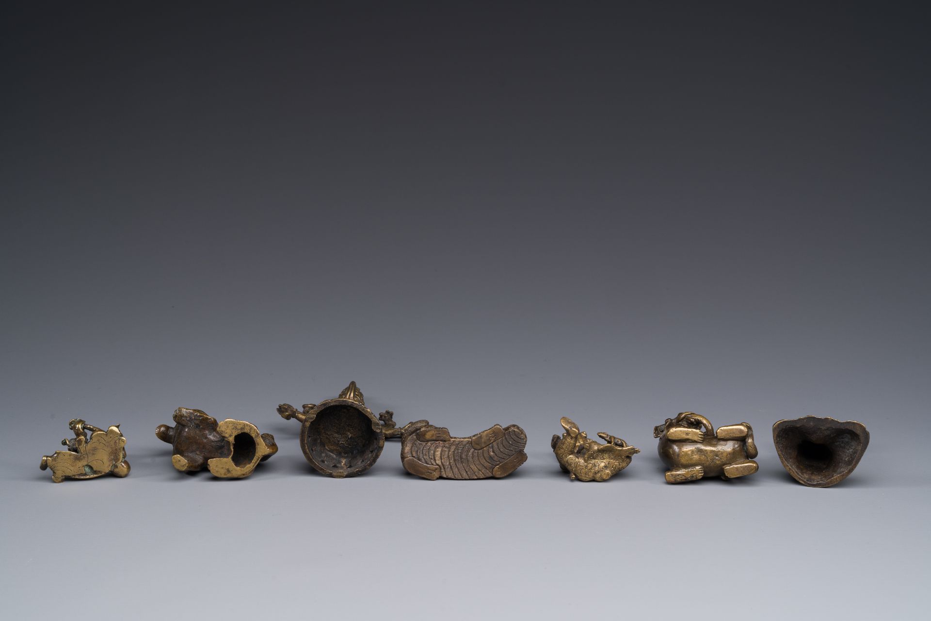 A collection of Chinese and Sino-tibetan bronze sculptures and paper weights, Qing - Image 4 of 4