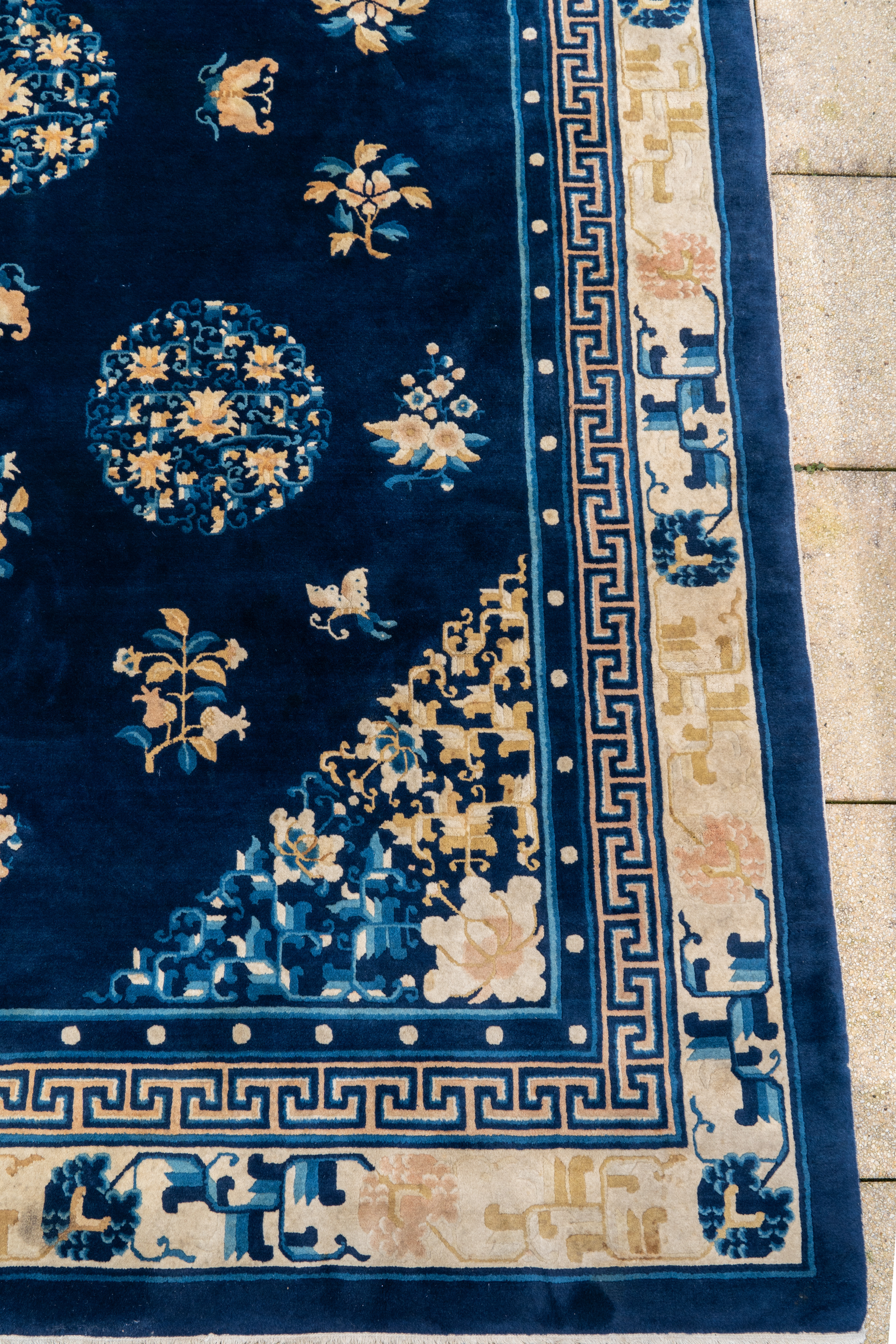 A large Chinese dark-blue-ground carpet with flowers and butterflies, 19/20th century - Image 2 of 5