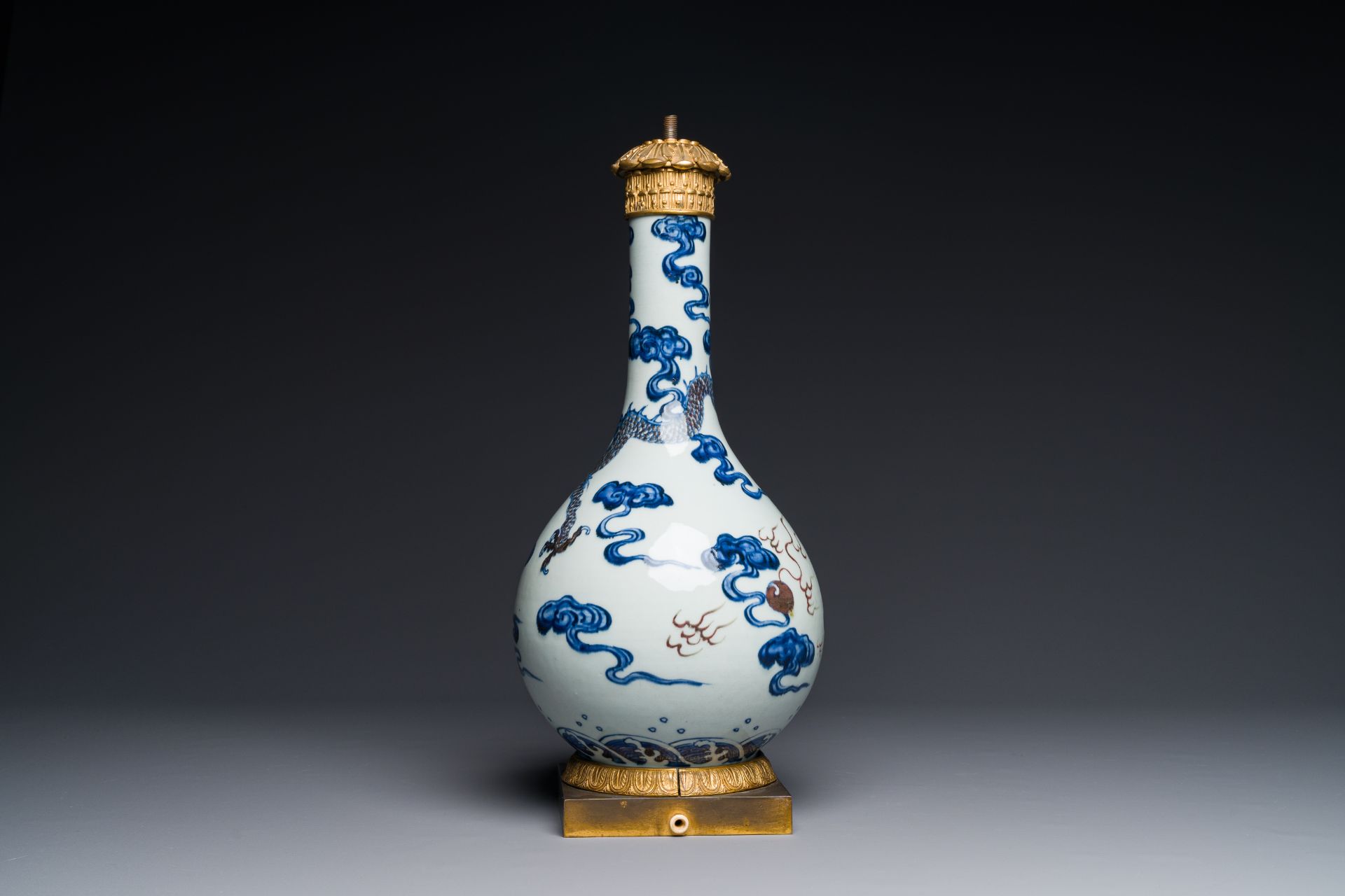 A Chinese blue, white and copper-red 'dragon' vase with gilt bronze mounts, 18th C. - Image 3 of 4