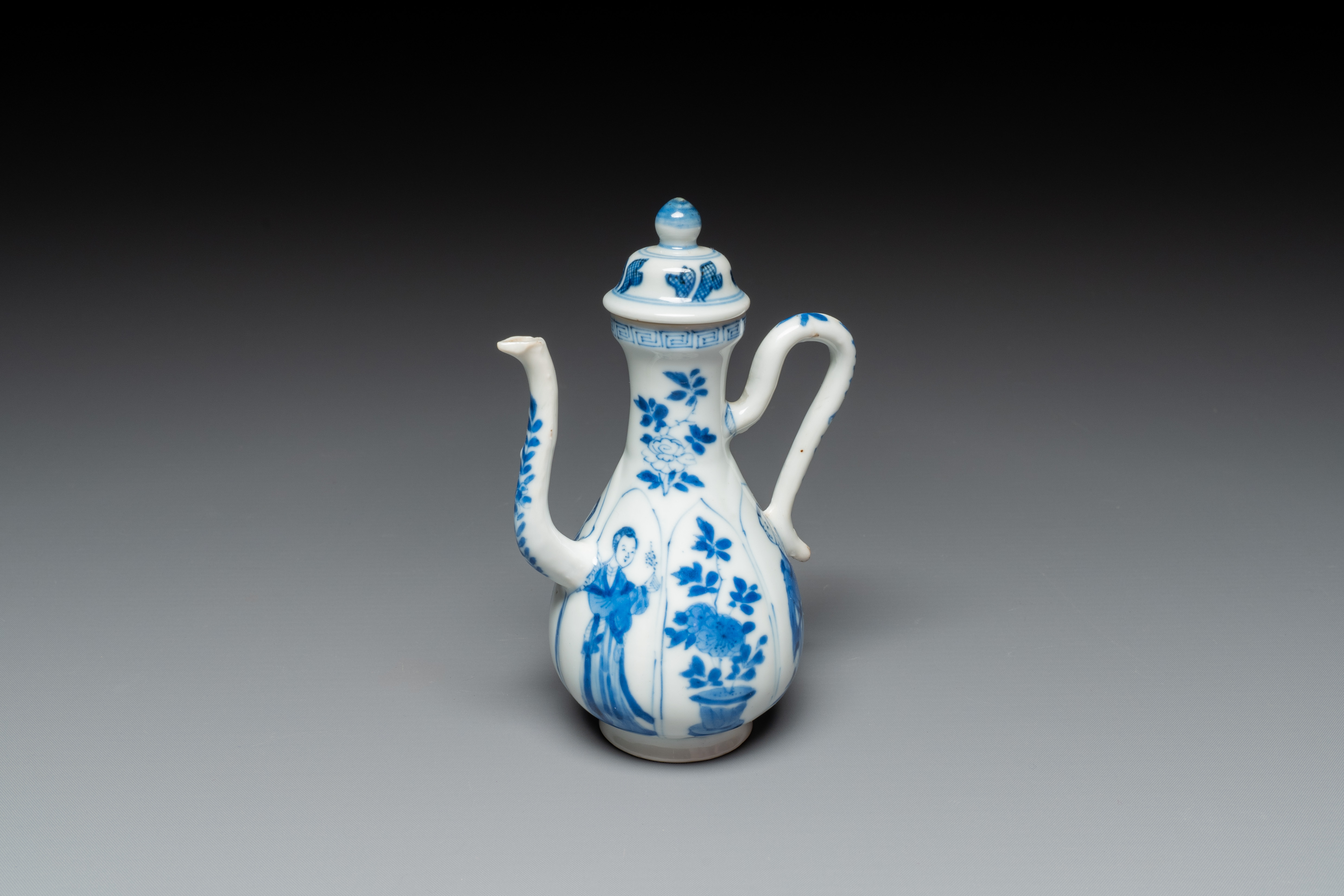 A Chinese blue and white 'Long Eliza' ewer and cover, jade mark, Kangxi