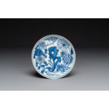 A Chinese blue and white plate with floral design, Xuande mark, Wanli