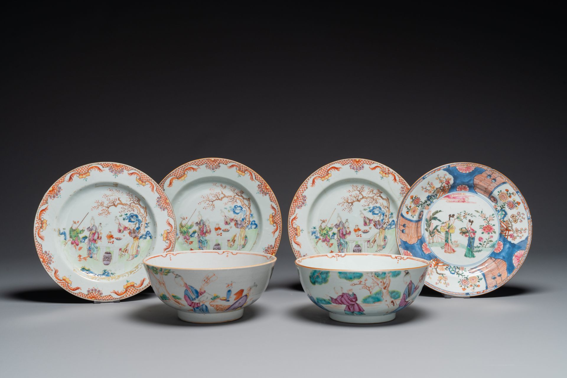 A pair of Chinese famille rose bowls and four plates, Yongzheng/Qianlong