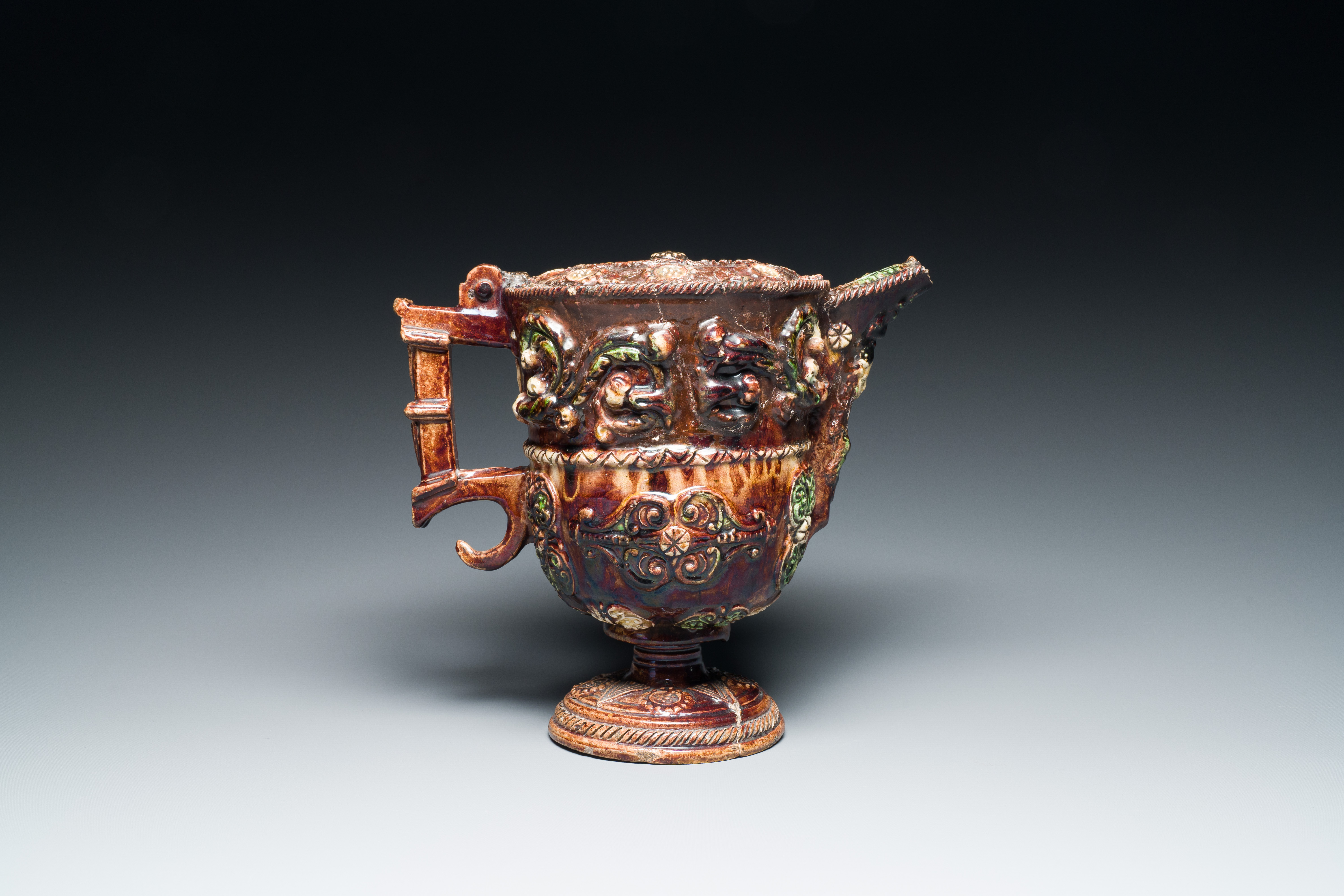 A French polychrome lead-glazed earthenware puzzle jug, Saintonge, 1st half 17th C. - Image 9 of 19