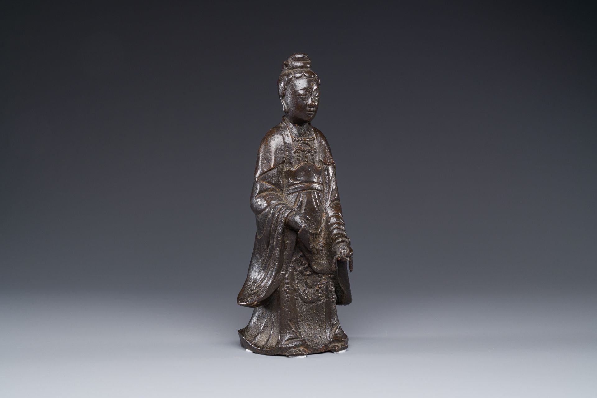 A Chinese bronze figure of a standing Guanyin, Ming