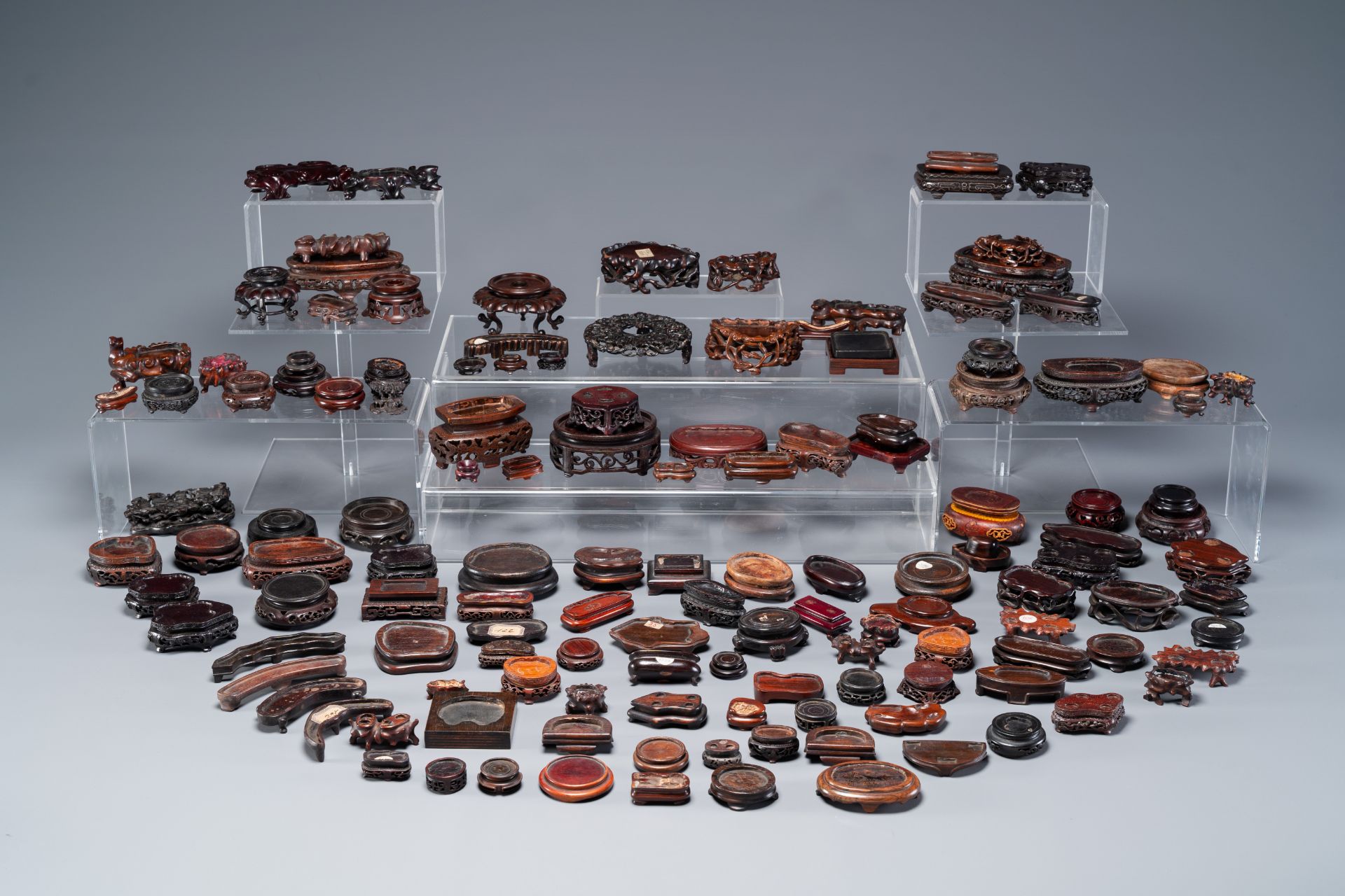 An extensive collection of 137 varied Chinese small wooden stands, 19/20th C.