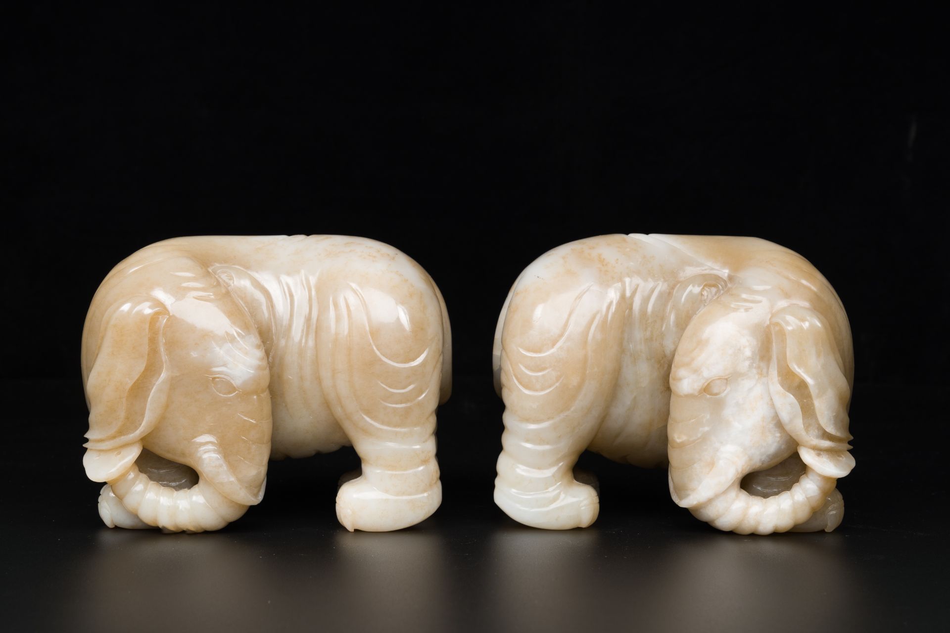A pair of Chinese white and russet jade sculptures of elephants, Qianlong - Image 4 of 9