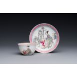 A Chinese famille rose cup and saucer with a court lady and a boy, Yongzheng