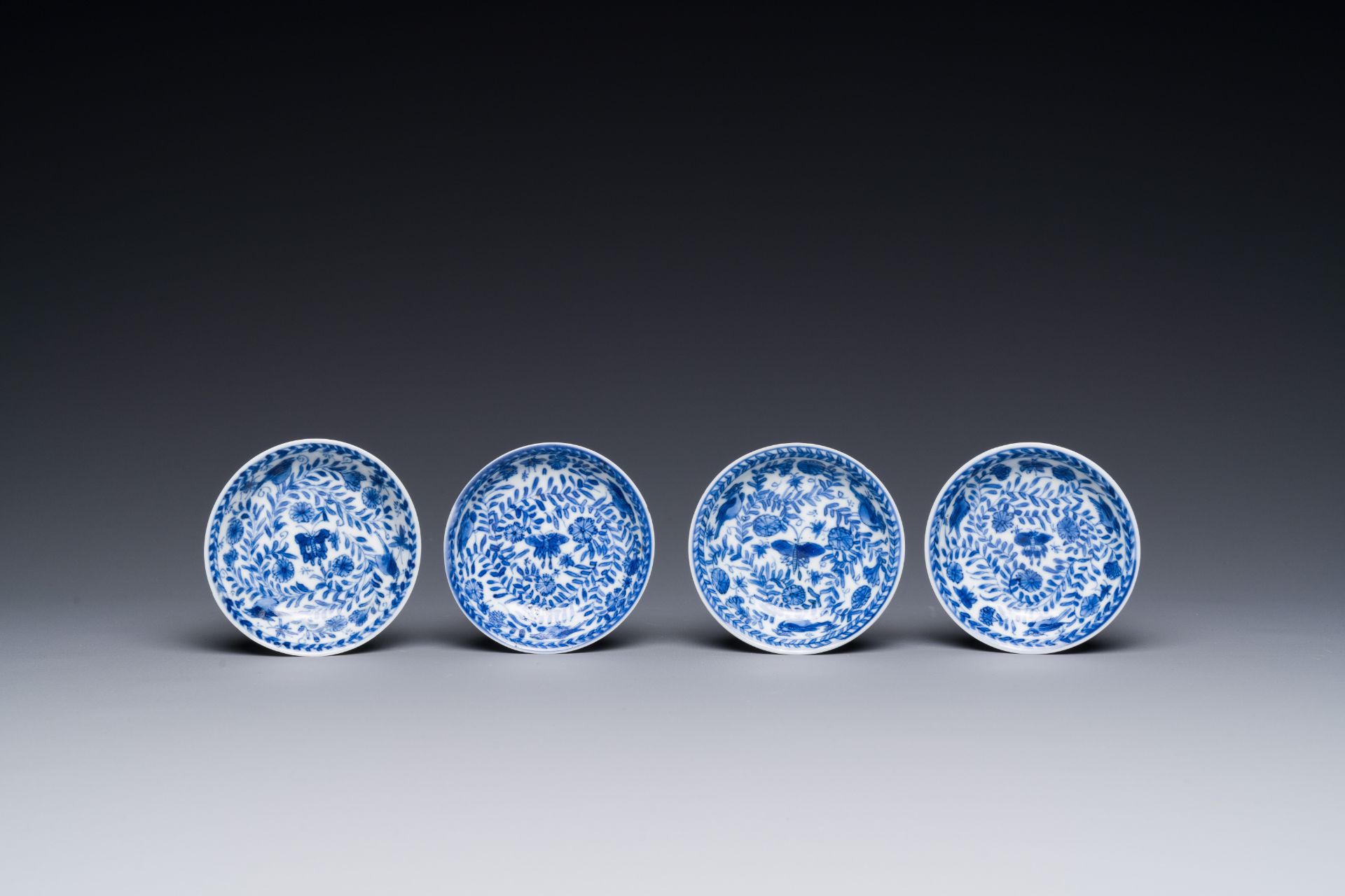 Four Chinese blue and white miniature cups and saucers, butterfly mark, Kangxi - Image 2 of 6