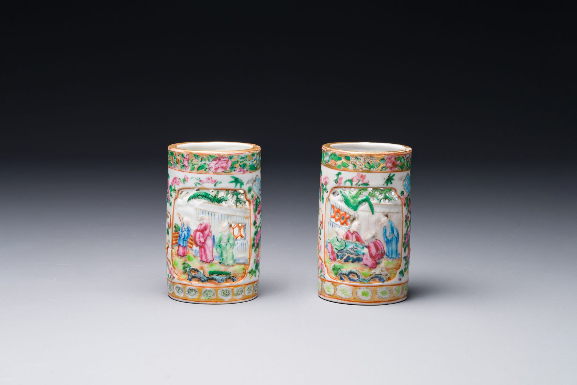 A pair of Chinese reticulated Canton famille rose brush pots, 19th C.