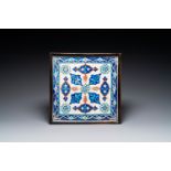 Four Iznik-style tiles with stylized floral design, Kutahya, Turkey, 19th C.