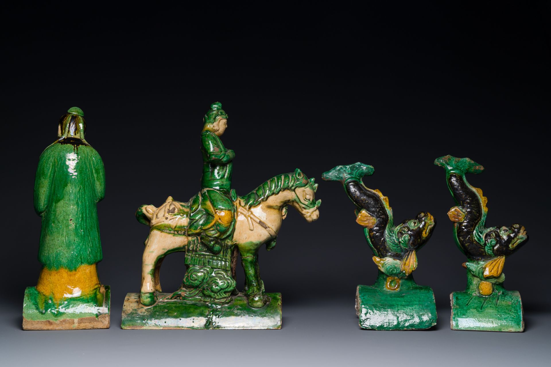 A pair of Chinese sancai roof tiles in the shape of a fish, a warrior on horseback and a sage, Ming - Image 3 of 4