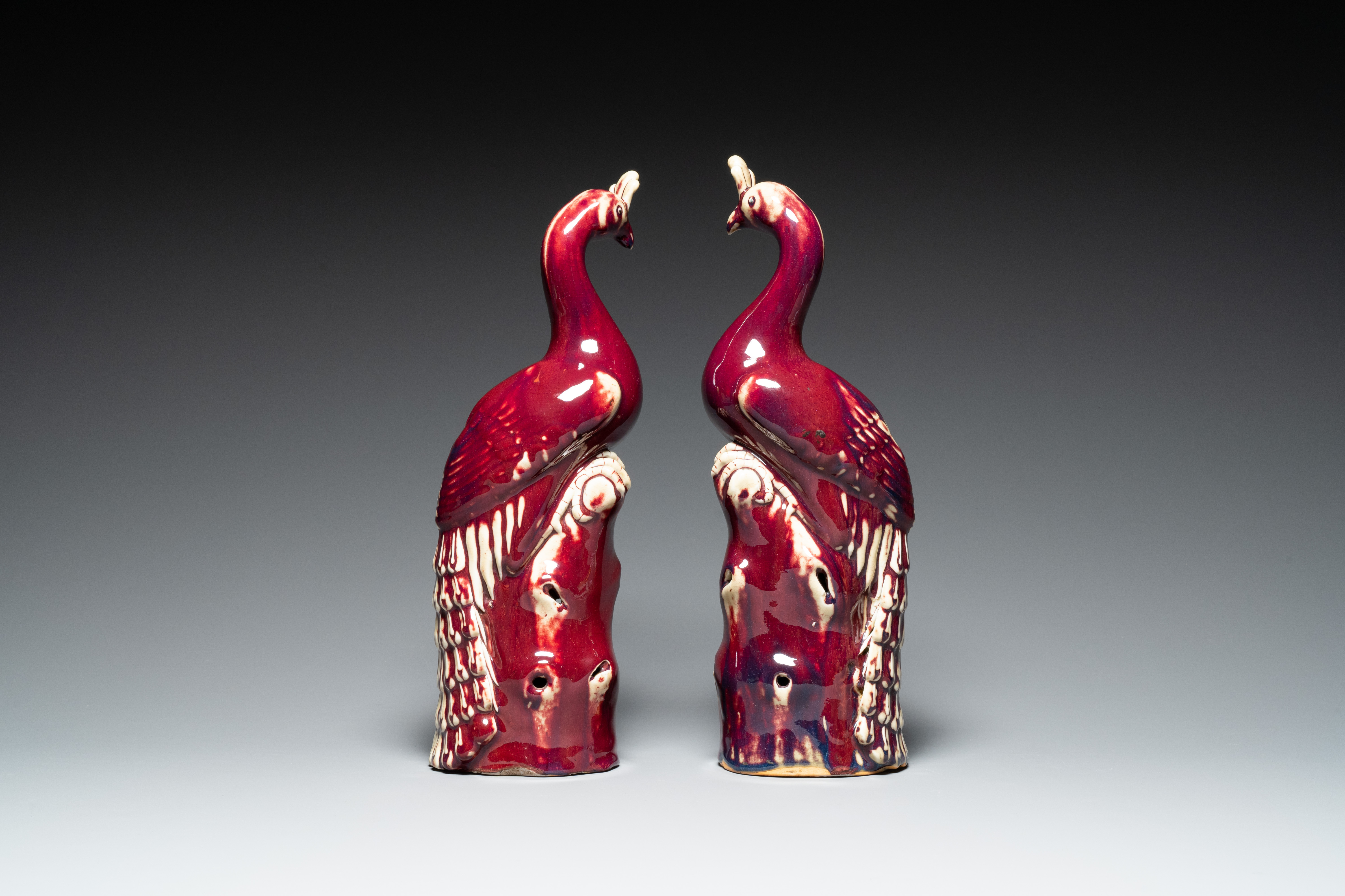 A pair of Chinese flambe-glazed models of peacocks on wooden stands, 19th C. - Image 4 of 7