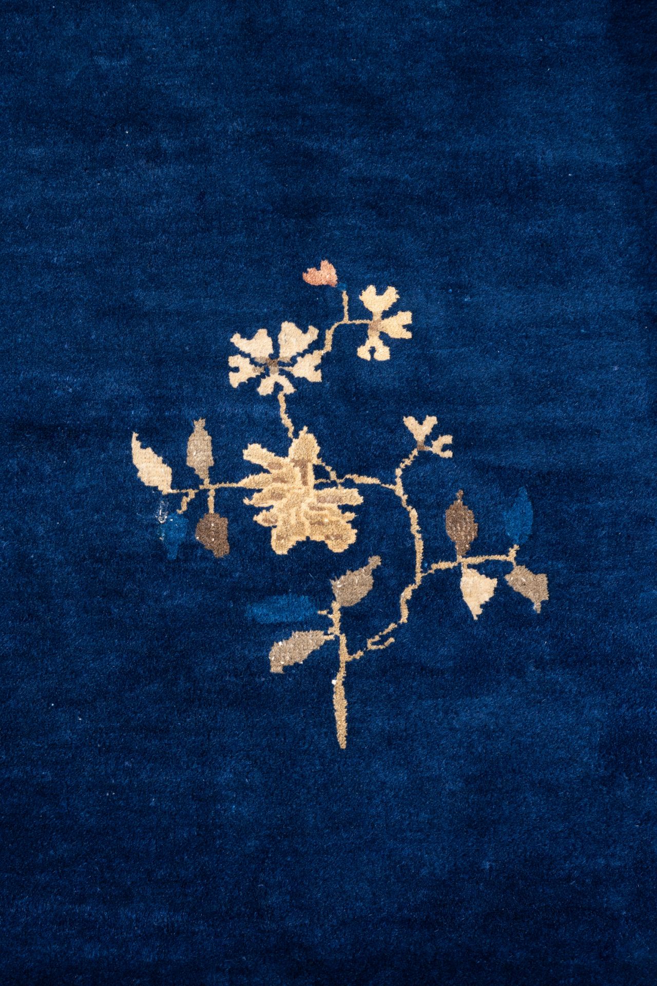 A large Chinese dark-blue-ground carpet with floral design, 19/20th century - Image 3 of 7