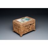 A Chinese Canton carved wooden casket with a famille rose plaque, Republic