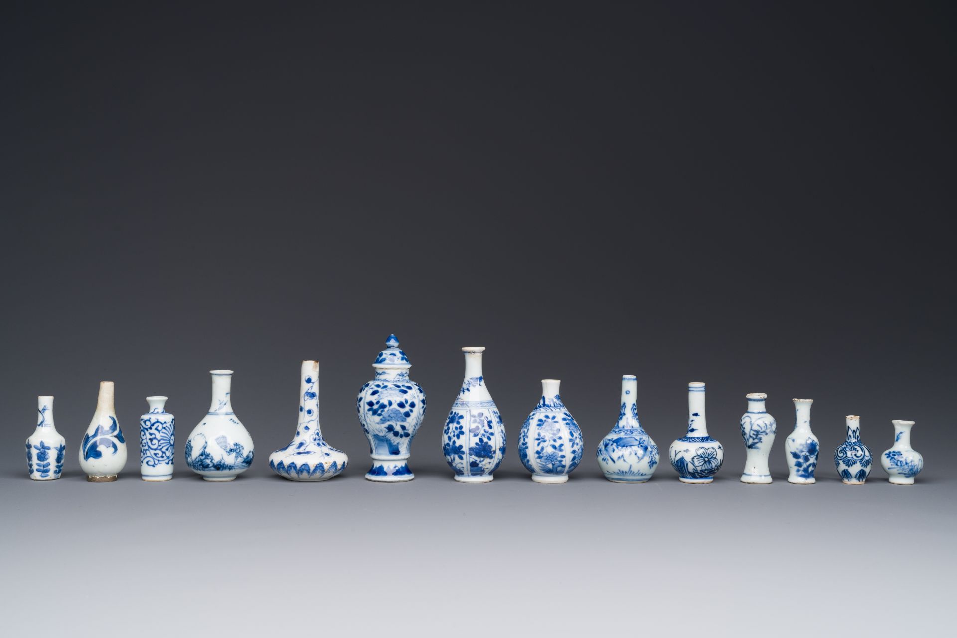 Fourteen Chinese blue and white miniature vases with floral design, Kangxi - Image 2 of 4