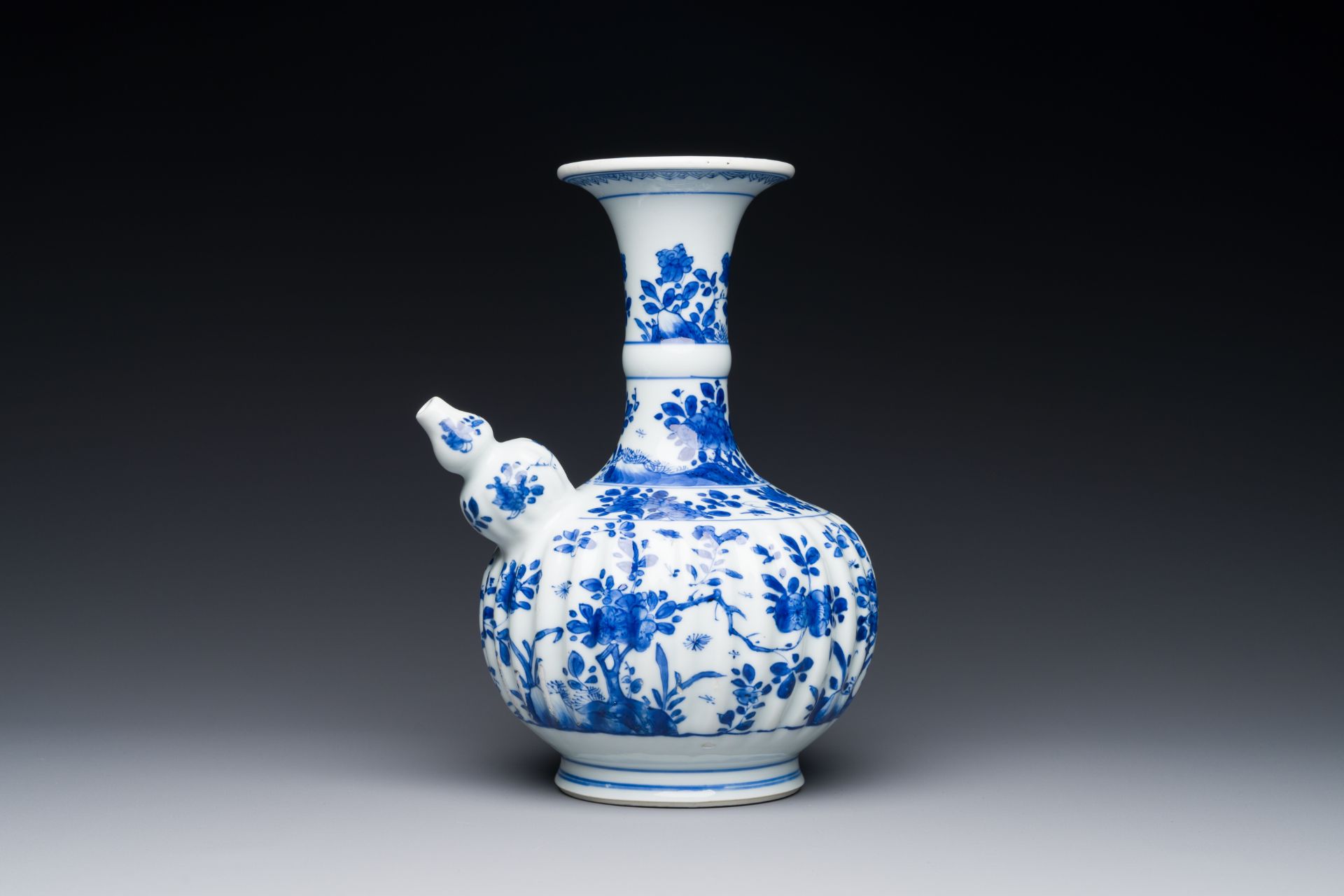 A Chinese blue and white kendi with floral design, Kangxi