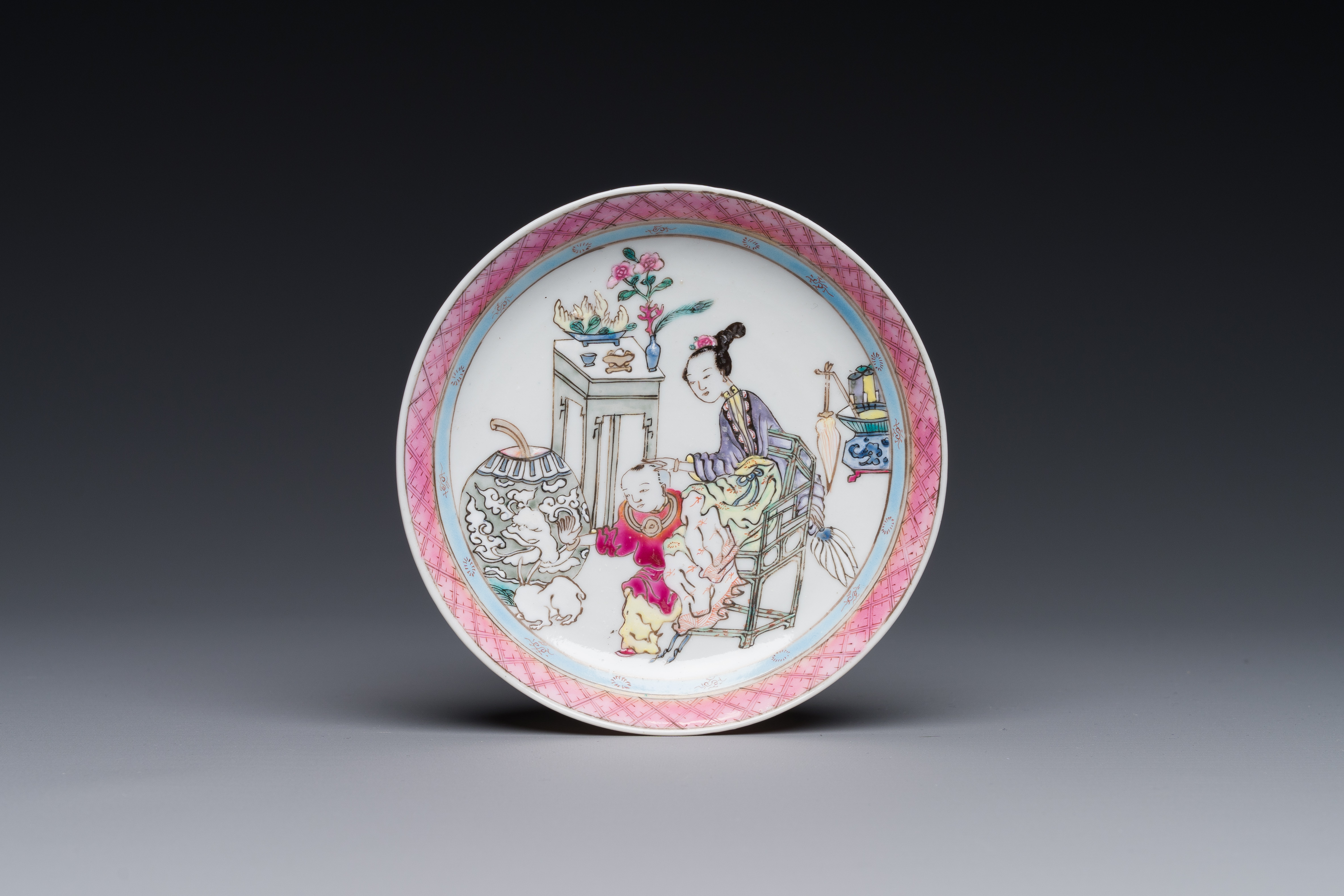 A Chinese famille rose cup and saucer with a court lady and a boy, Yongzheng - Image 2 of 6