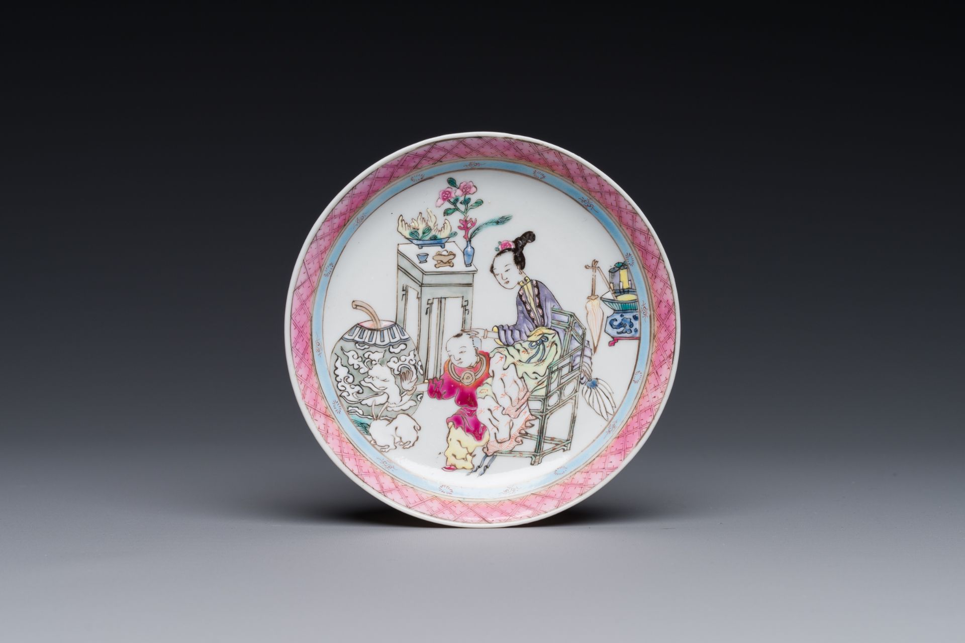 A Chinese famille rose cup and saucer with a court lady and a boy, Yongzheng - Image 2 of 6