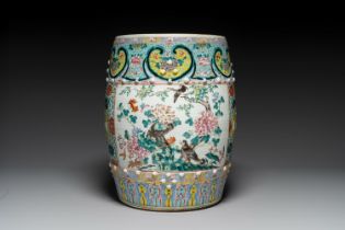 A Chinese famille rose garden seat with birds among blossoming branches, 19th C.