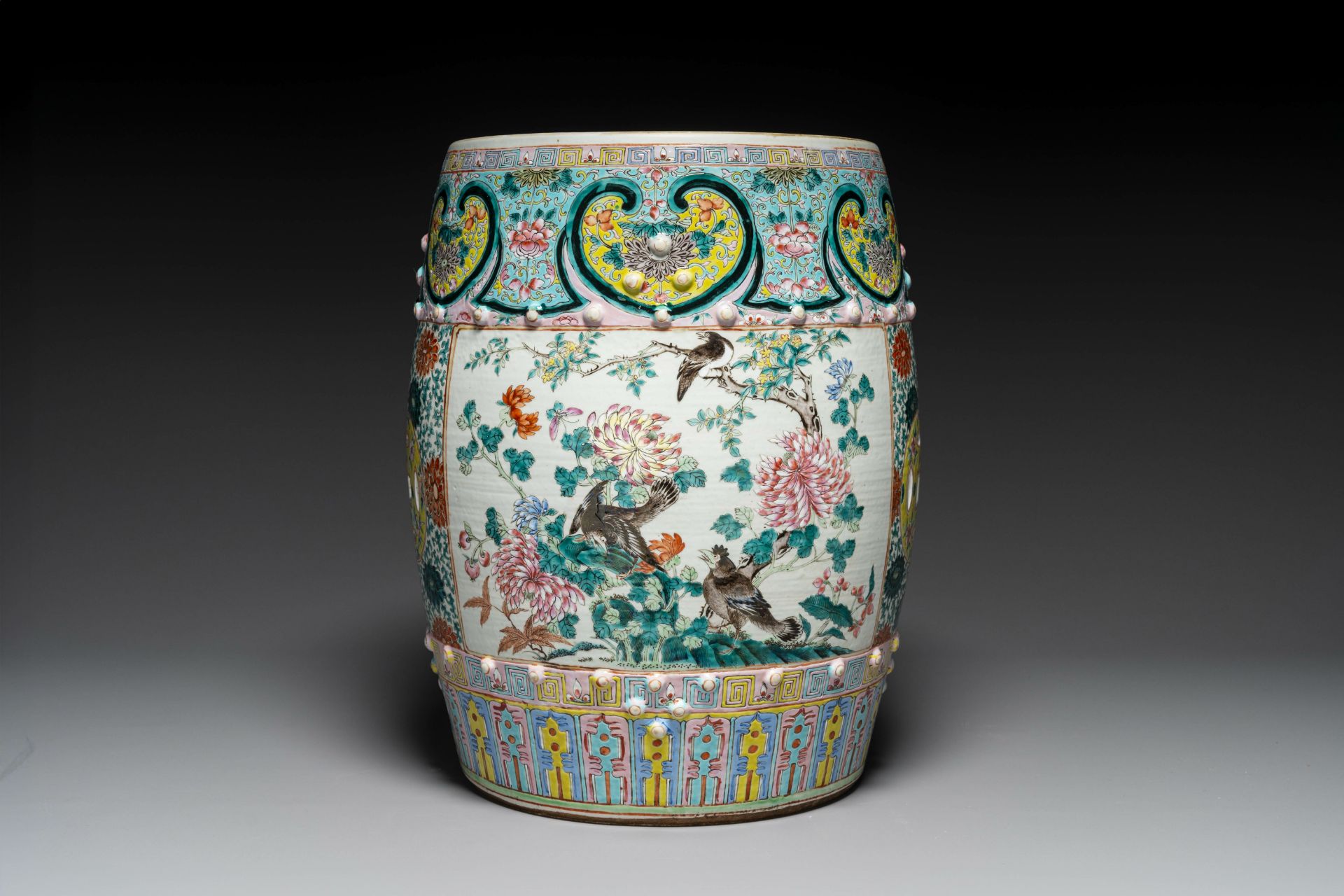 A Chinese famille rose garden seat with birds among blossoming branches, 19th C.