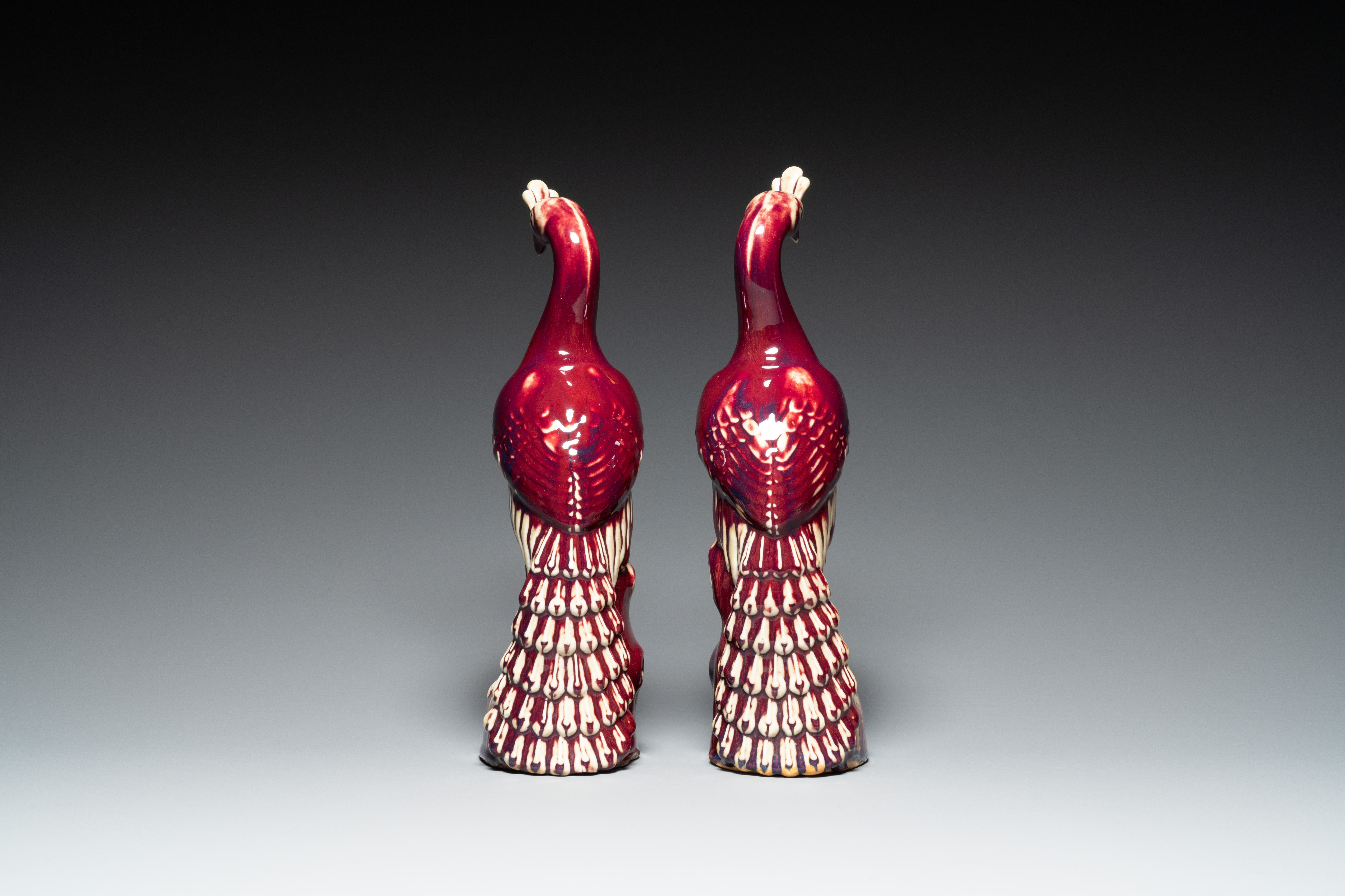 A pair of Chinese flambe-glazed models of peacocks on wooden stands, 19th C. - Image 5 of 7