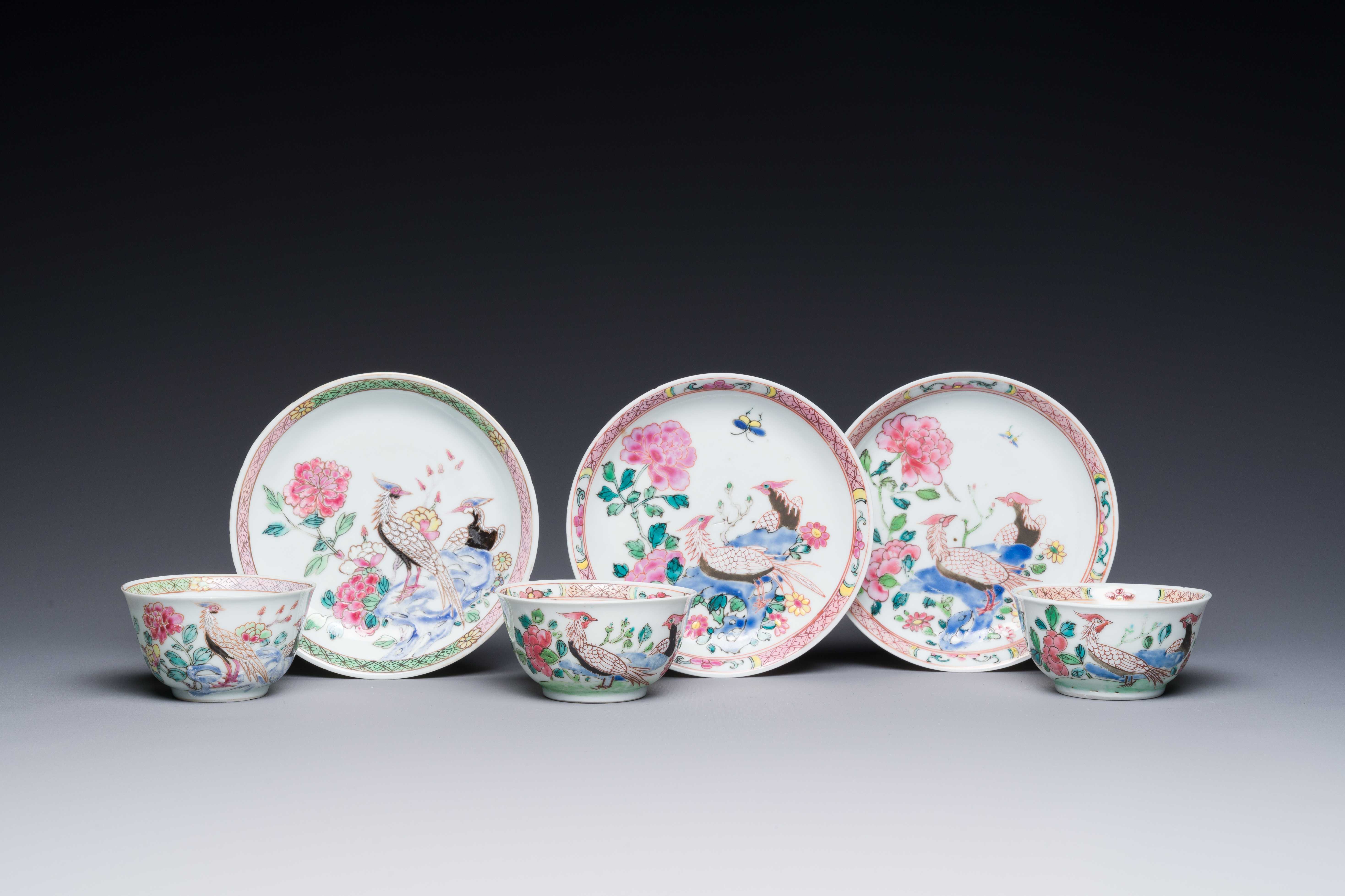 Three Chinese famille rose 'pheasant' cups and saucers, Yongzheng