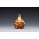 A rare Chinese brown-overlay white glass snuff bottle with chilong design, Qianlong/Jiaqing