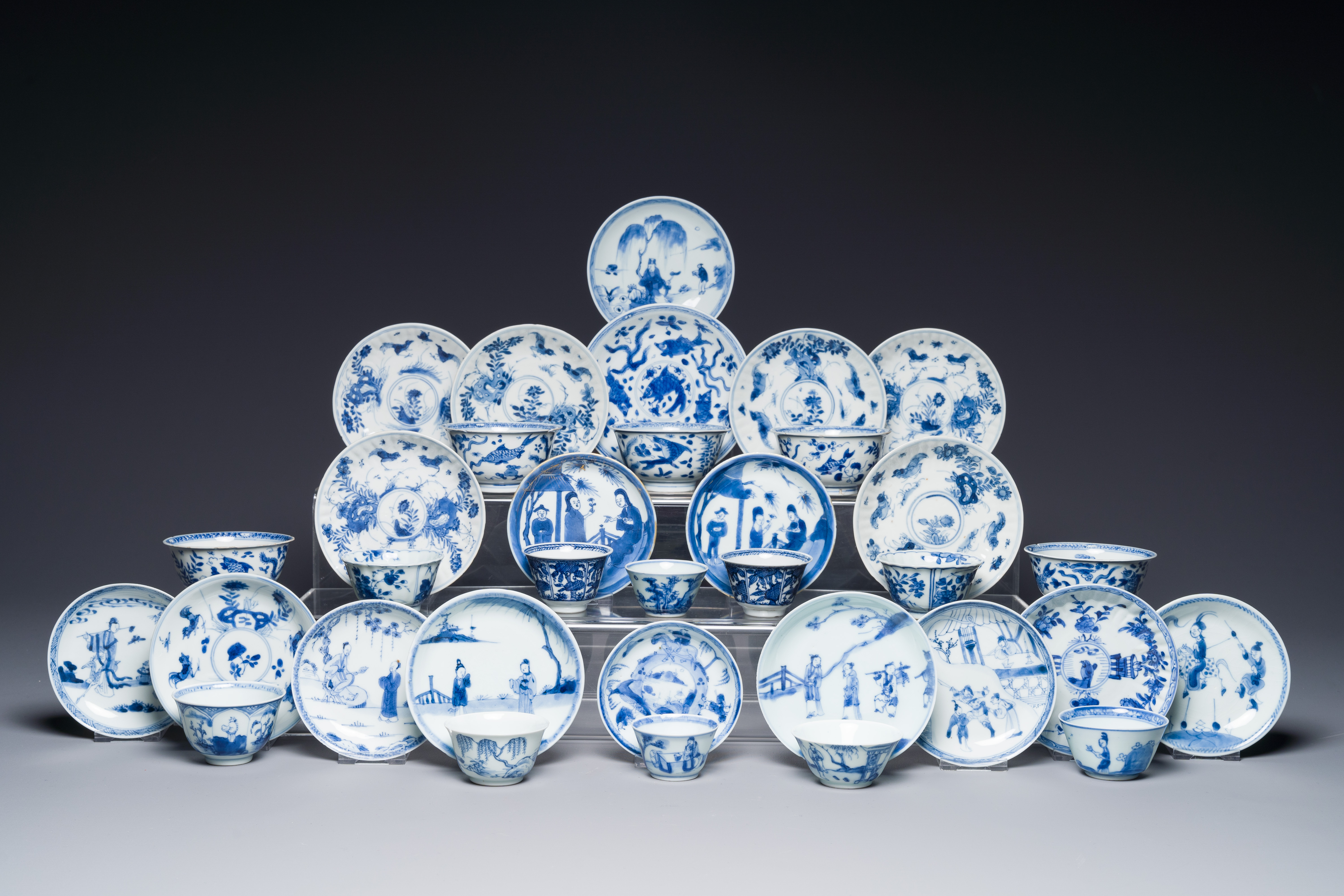 A collection of 15 Chinese blue-white cups and 19 saucers, Kangxi/Yongzheng