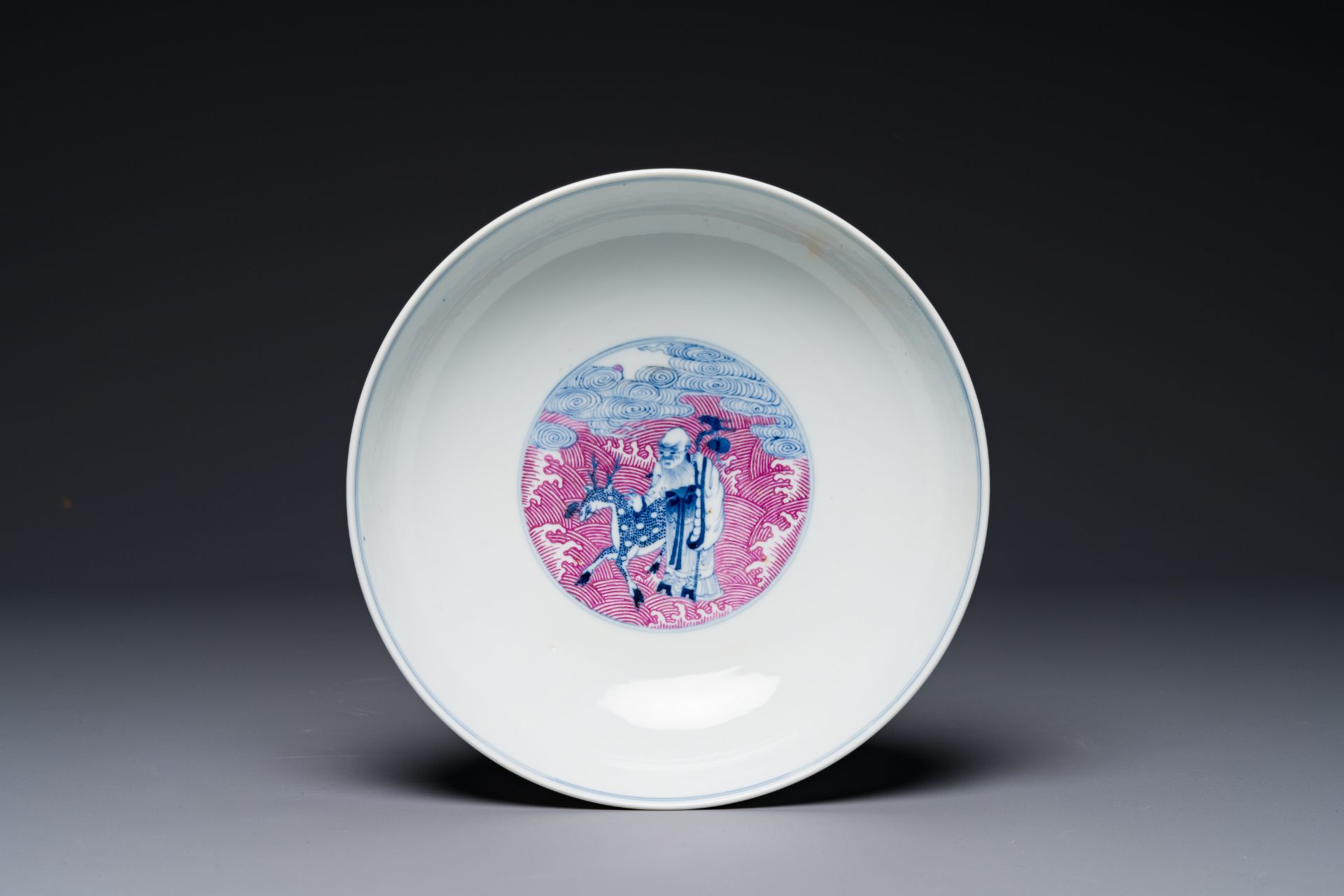 A Chinese blue, white and puce-enamelled 'Eight Immortals' bowl, Guangxu mark and of the period