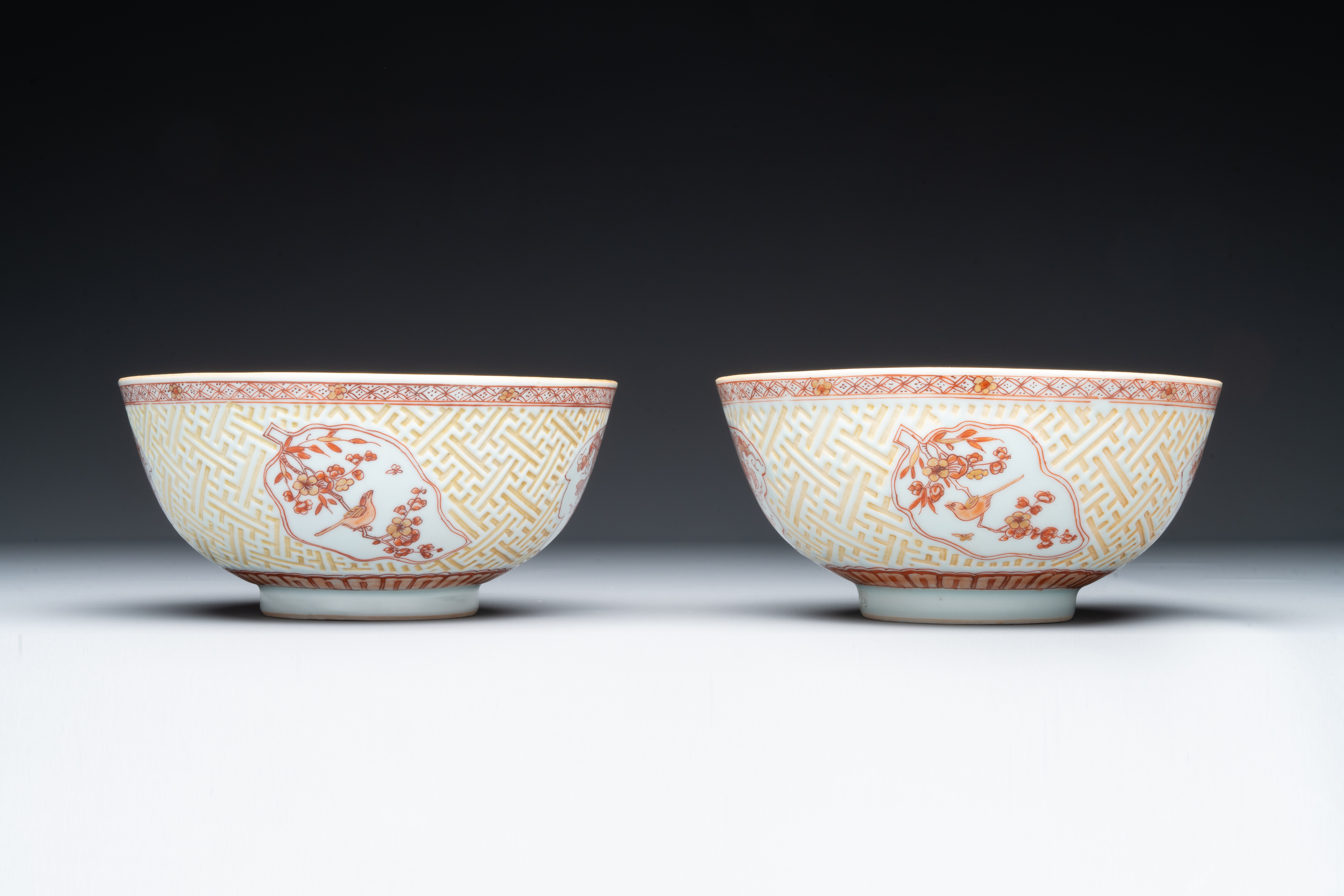 A pair of Chinese iron-red-decorated and gilt bowls with relief design, Kangxi - Image 2 of 8