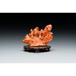 A Chinese red coral 'Eight Immortals' group on wooden stand, 19/20th C.