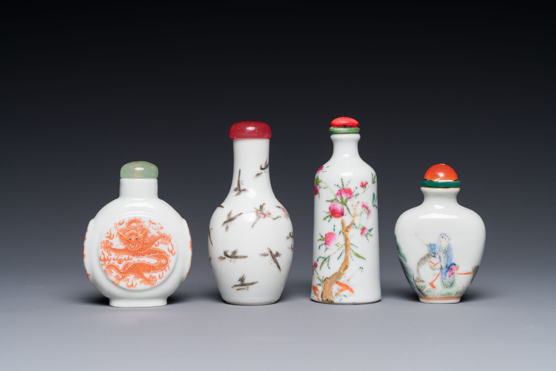 Four Chinese famille rose and iron-red snuff bottles, Qianlong and Yongzheng mark, 19/20th C.