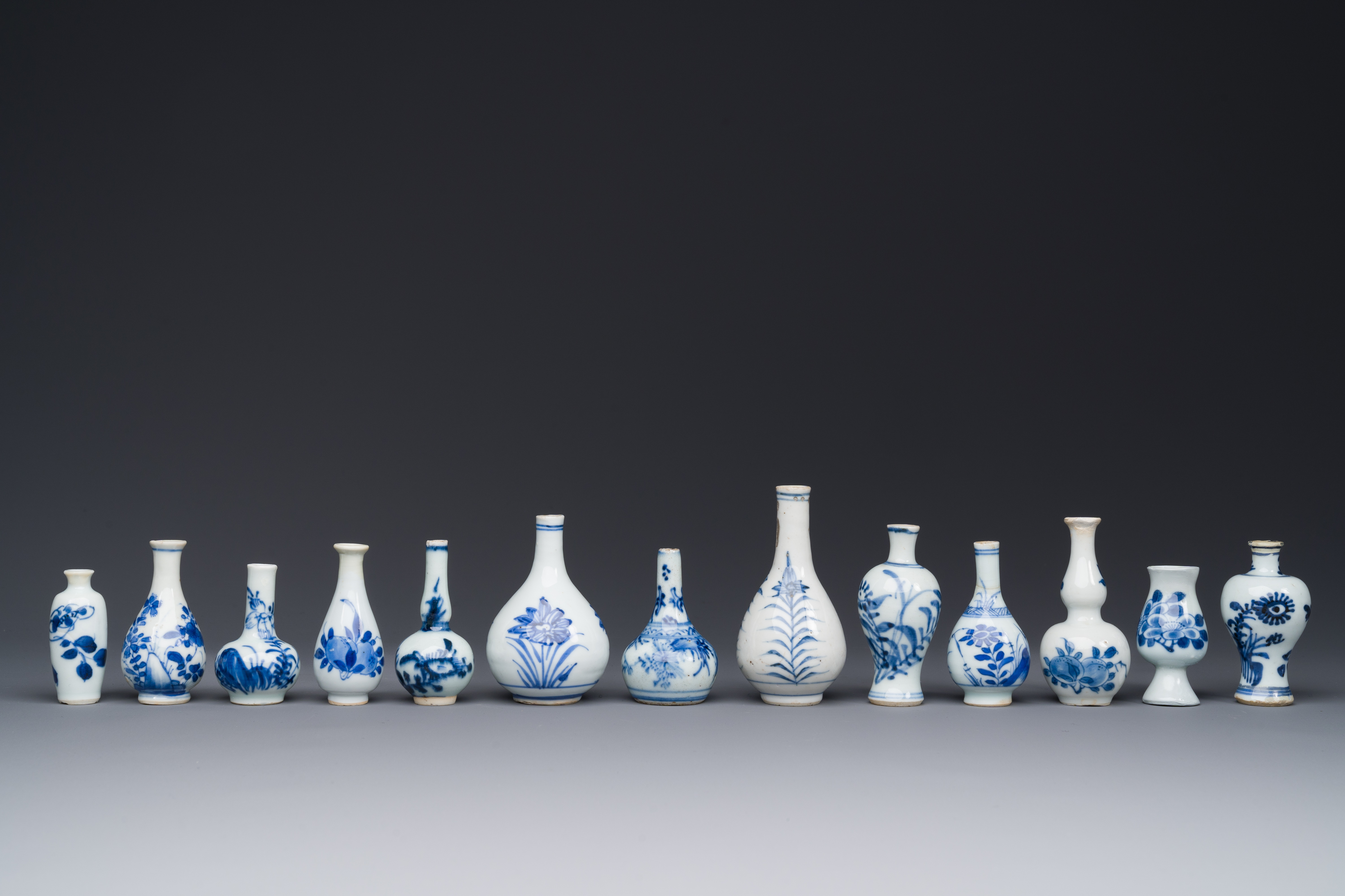 Thirteen Chinese blue and white miniature vases with floral design, Kangxi - Image 2 of 5