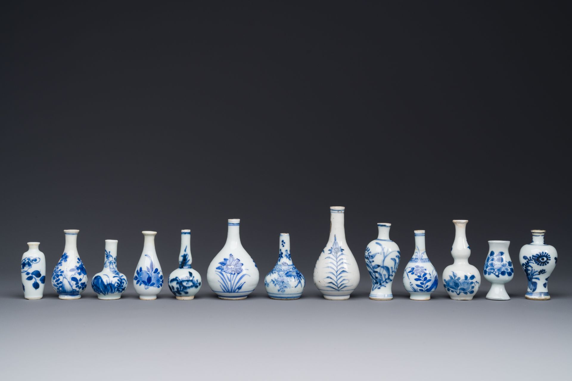 Thirteen Chinese blue and white miniature vases with floral design, Kangxi - Image 2 of 5