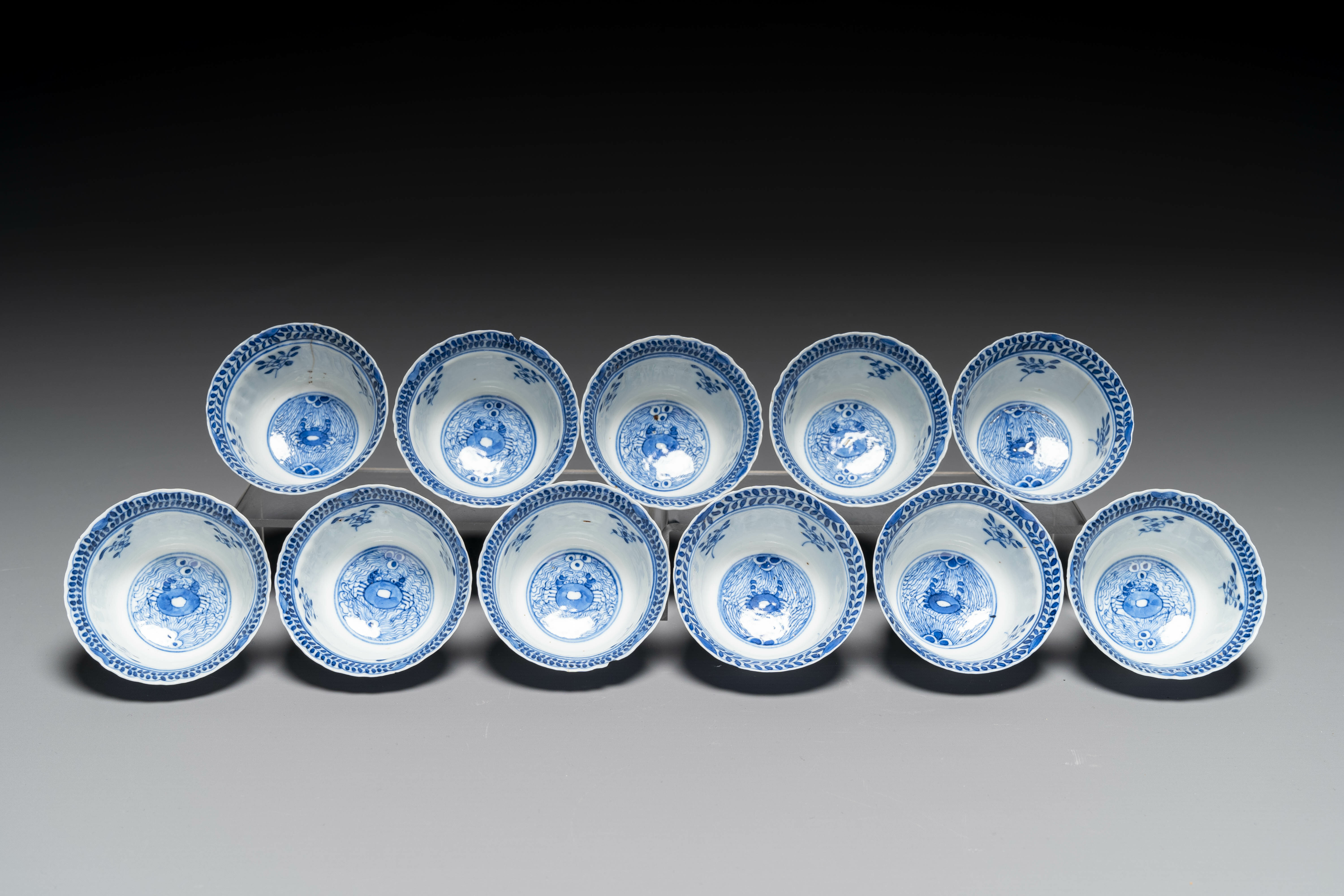 Eleven Chinese blue and white 'crab and fish' cups and saucers, Kangxi mark, Guangxu - Image 4 of 7