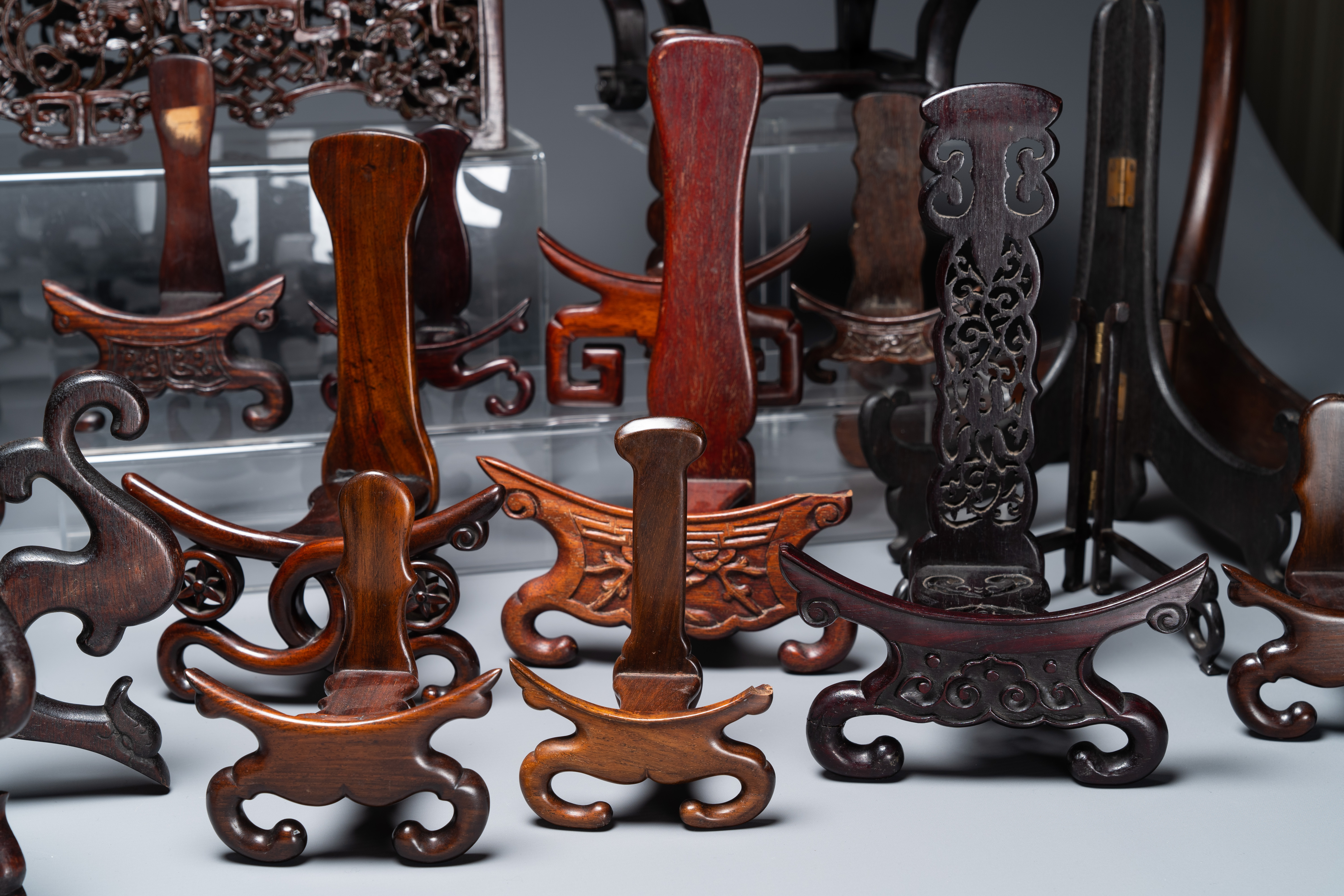 A collection of 26 varied Chinese wooden stands, 2 with marble tops, 19/20th C. - Image 5 of 6